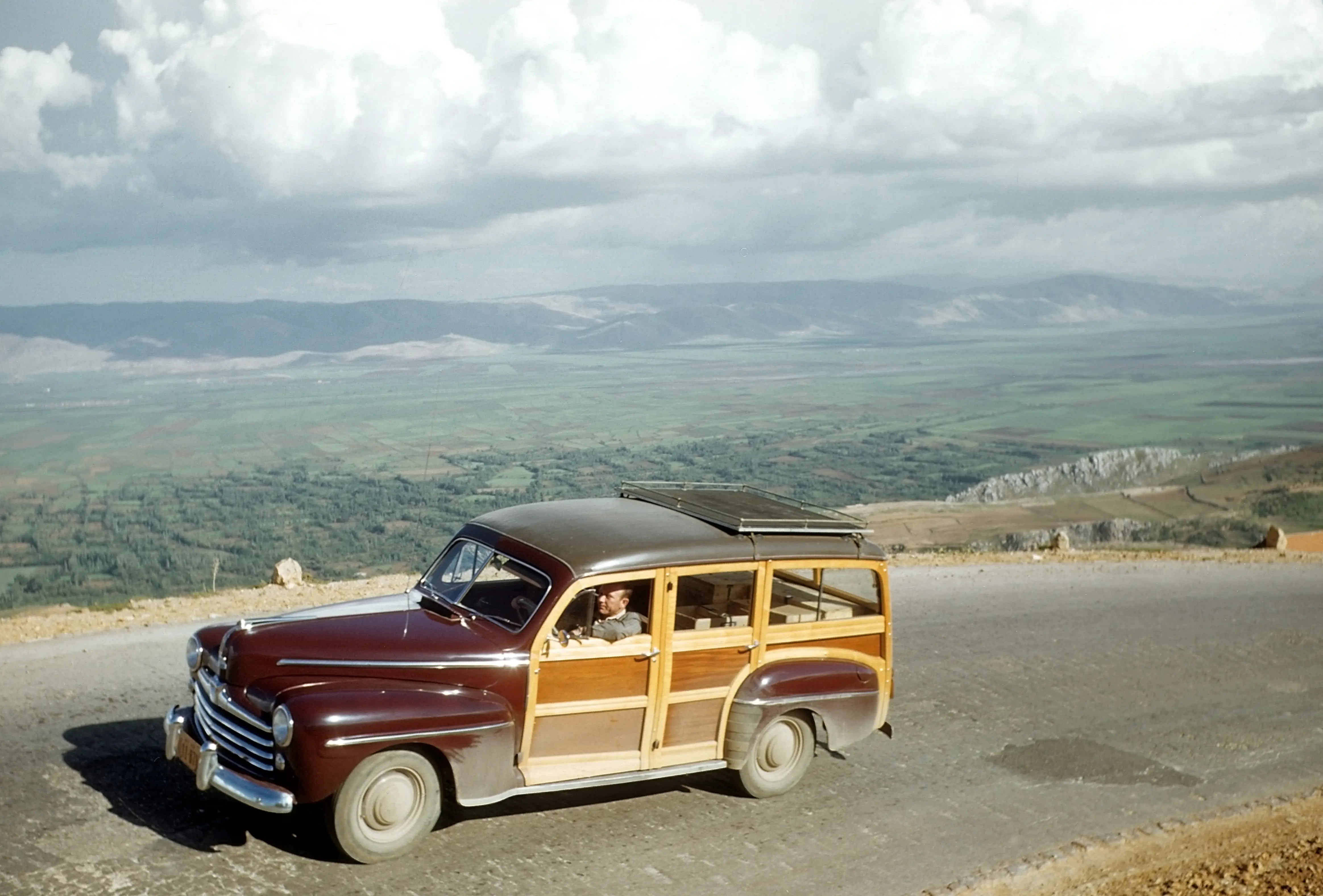 BEIRUT, LEBANON - MAY 13,1948: A view as a man drives his Woodie on the road to Damascus in Beirut, Lebanon.