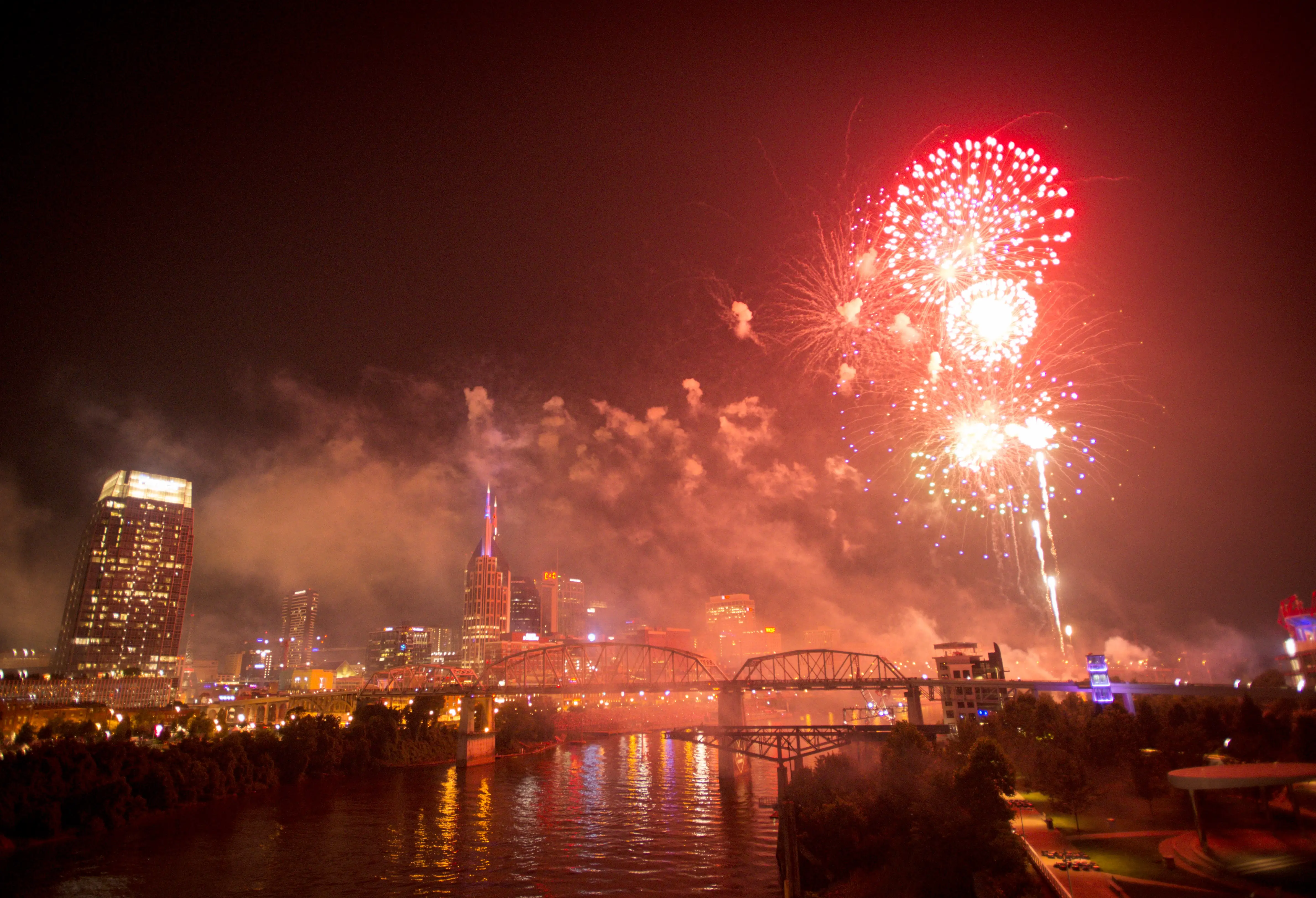 Nashville, Tennessee, skyline with fireworks above.