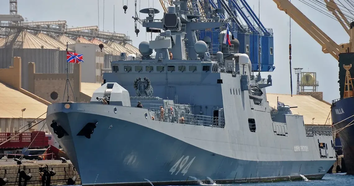A Russian warship sailing between England and France fired warning shots at a British civilian yacht