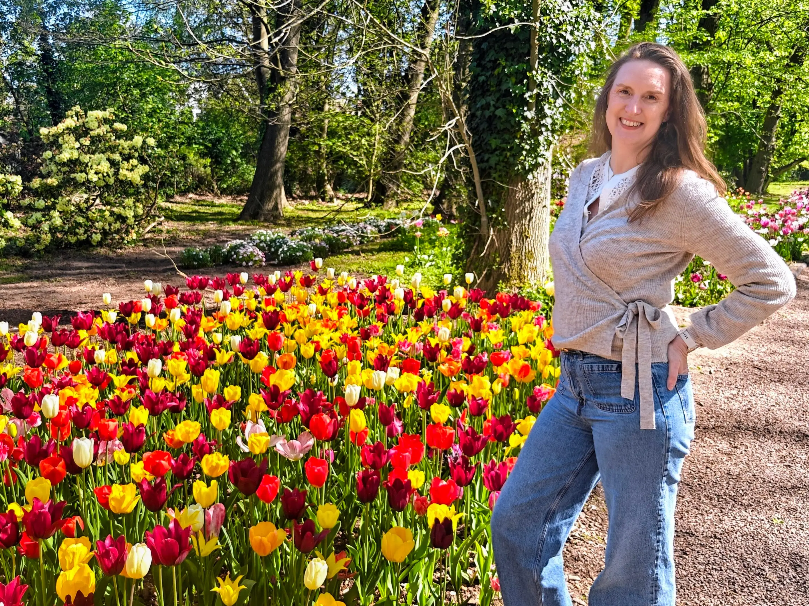 A woman posing by the Floralia spring flower exhibition at Groot-Bijgaarden Castle in Belgium.