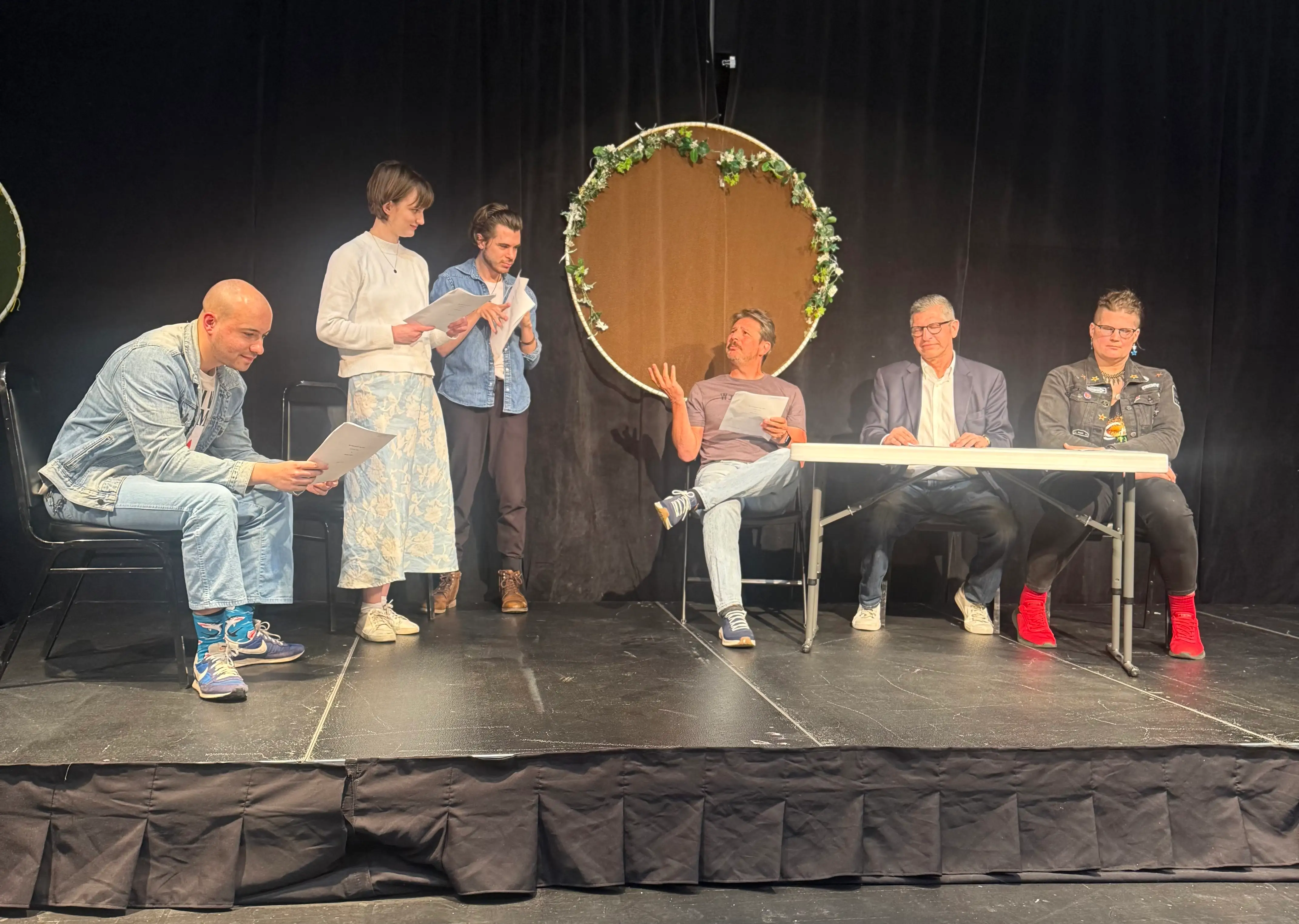 Group of people on stage perofmring