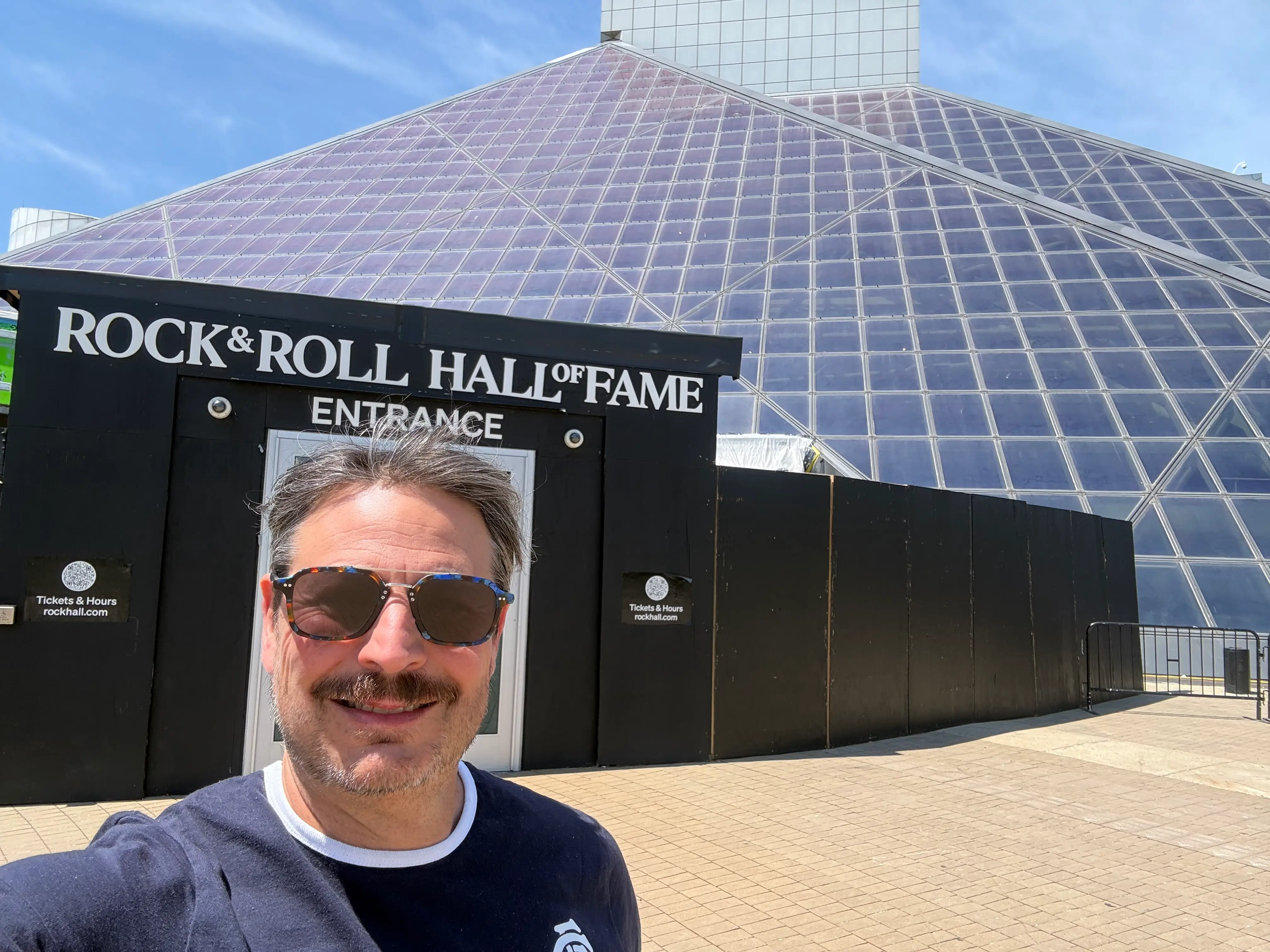 Author Ash Jurberg taking selfie outside Rock and Roll Hall of Fame