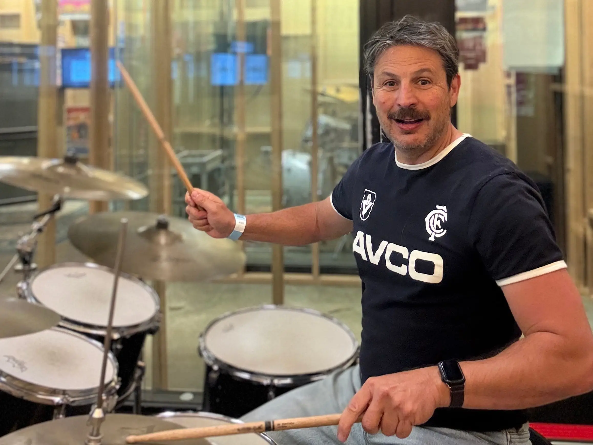 Author Ash Jurberg playing drums in rock and roll hall of fame