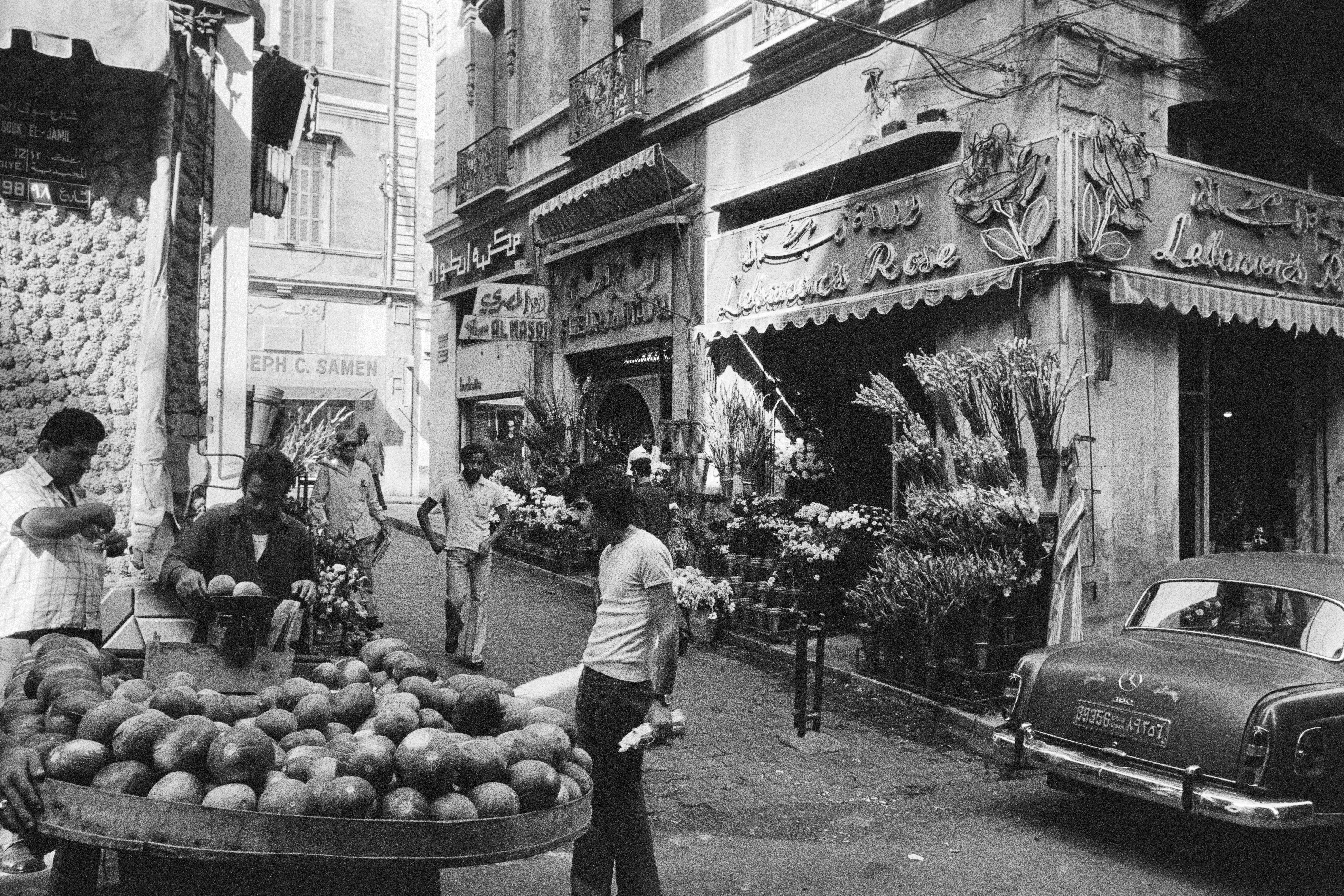 A street vendor sells watermelons from a cart in October 1973 in front of a flower shop on a street in downtown Beirut.