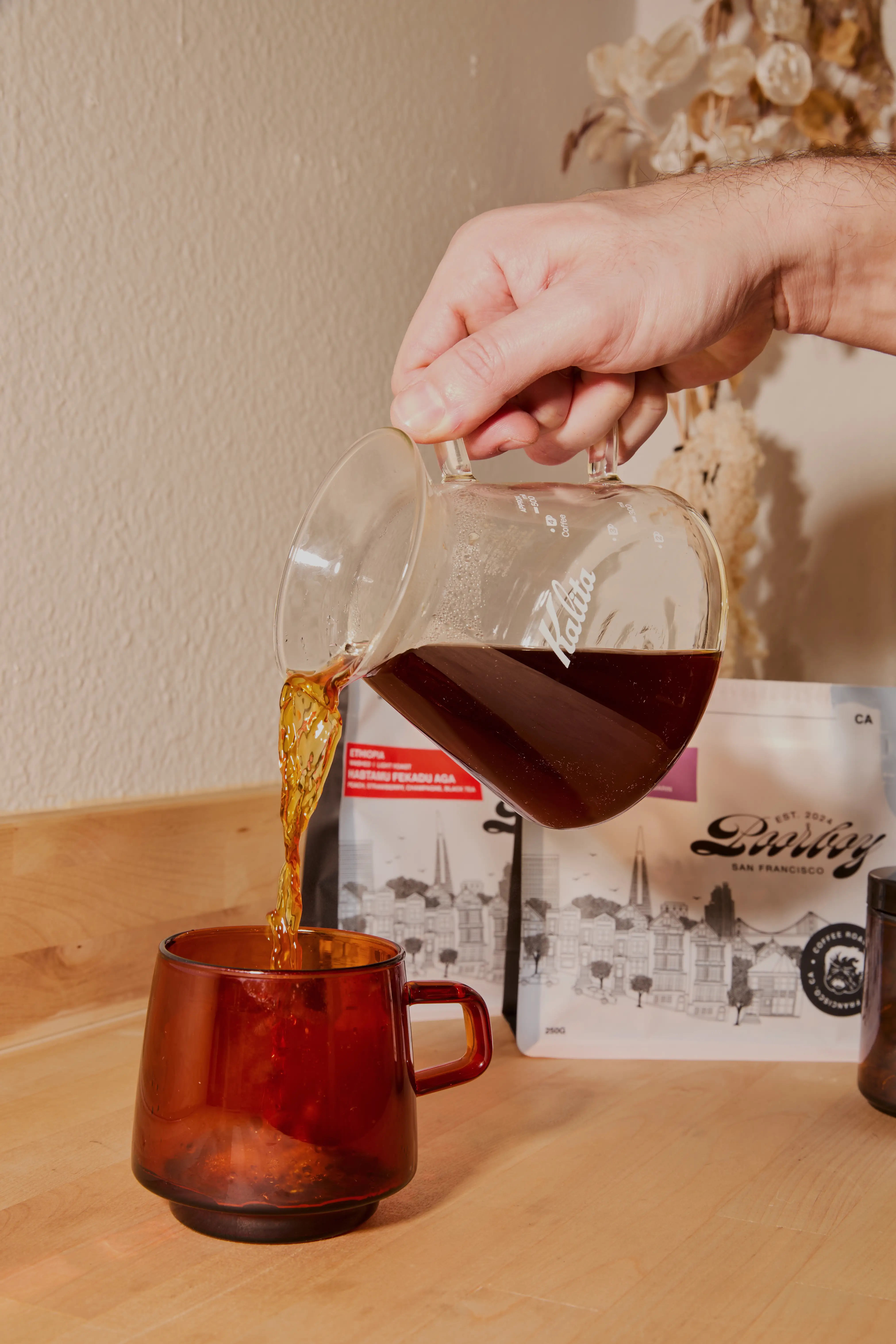 Brandon pours some Poorboy coffee.