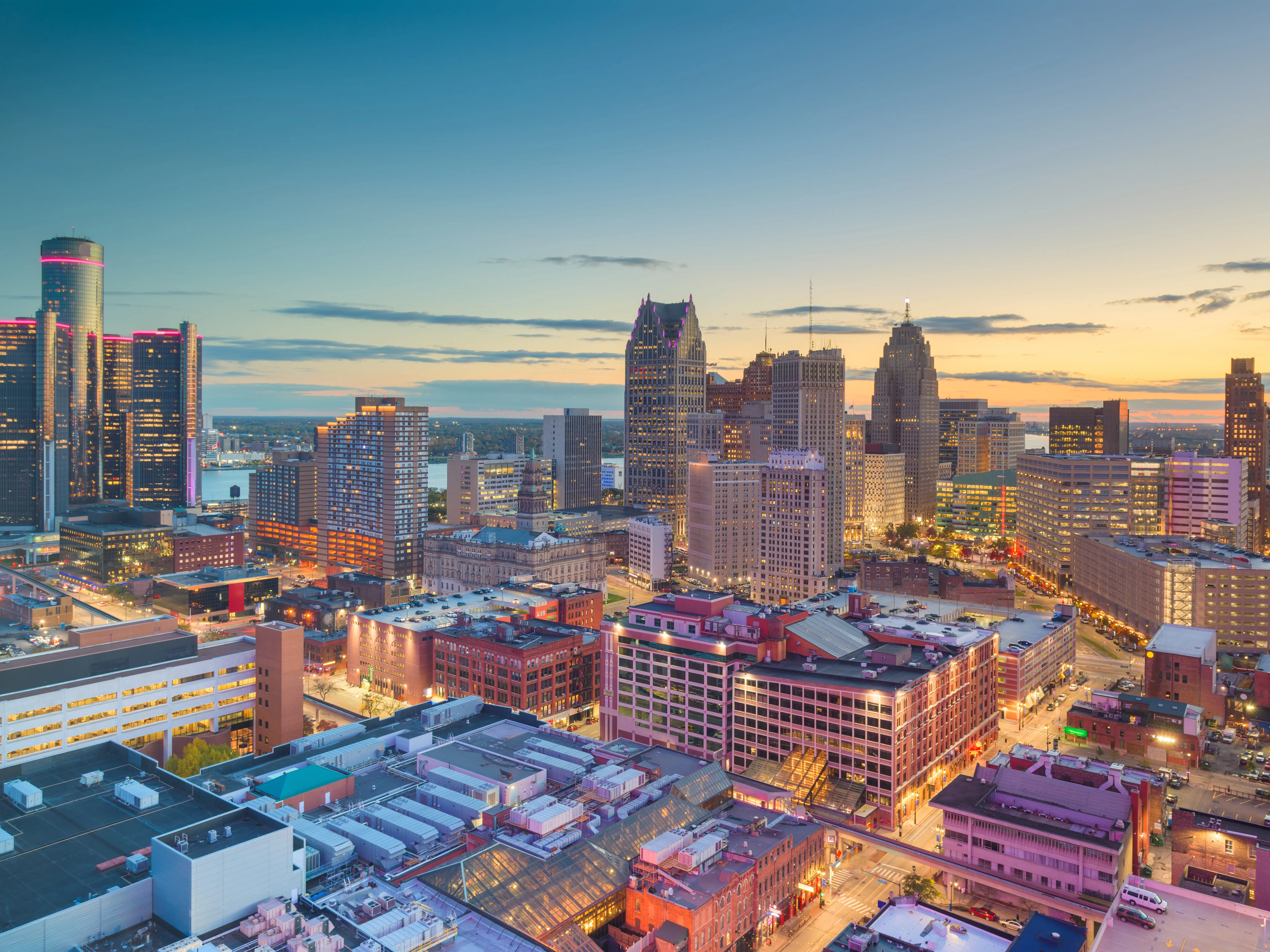 Detroit, Michigan, USA downtown skyline from above at dusk.