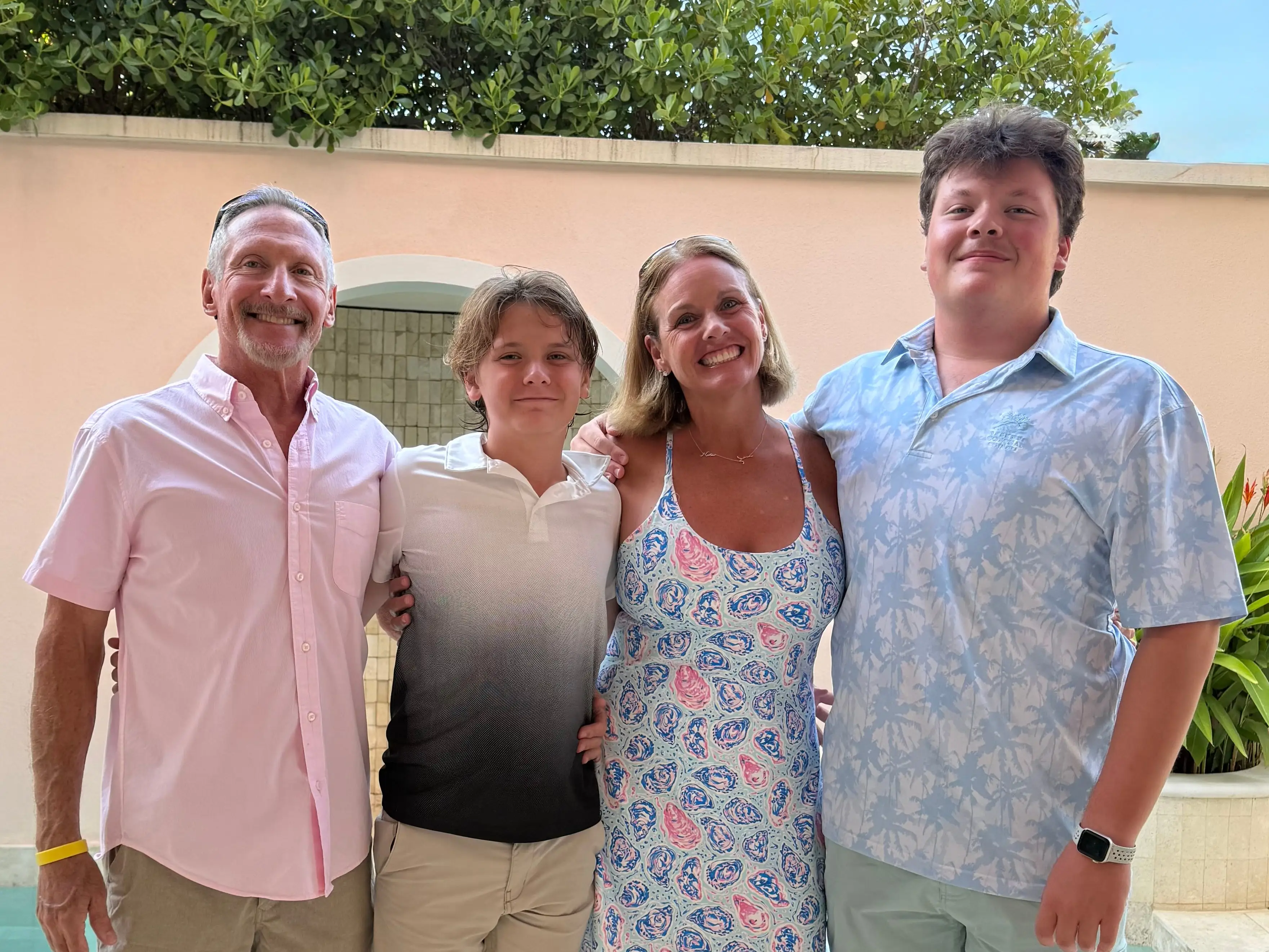 A family of four posing for a photo.