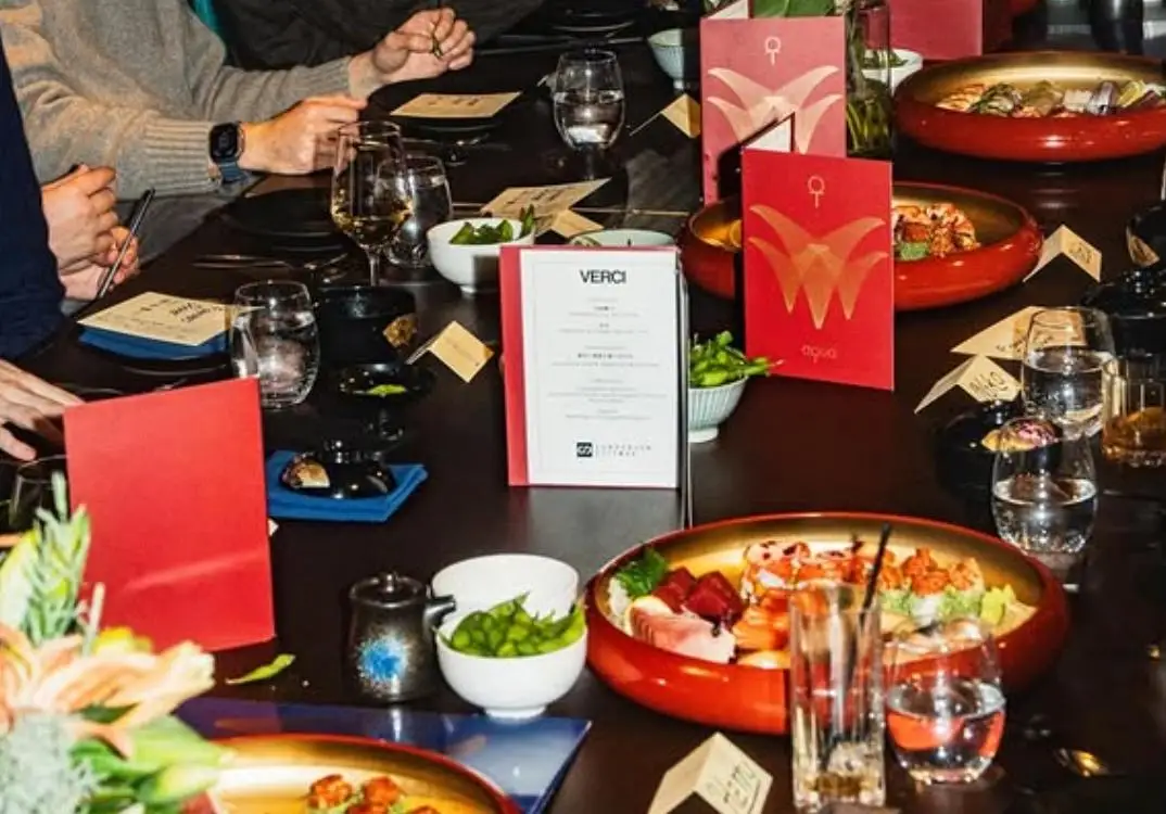 Dinner table with bowls of sushi and edamame at an event hosted by coworking and tech events startup Verci's