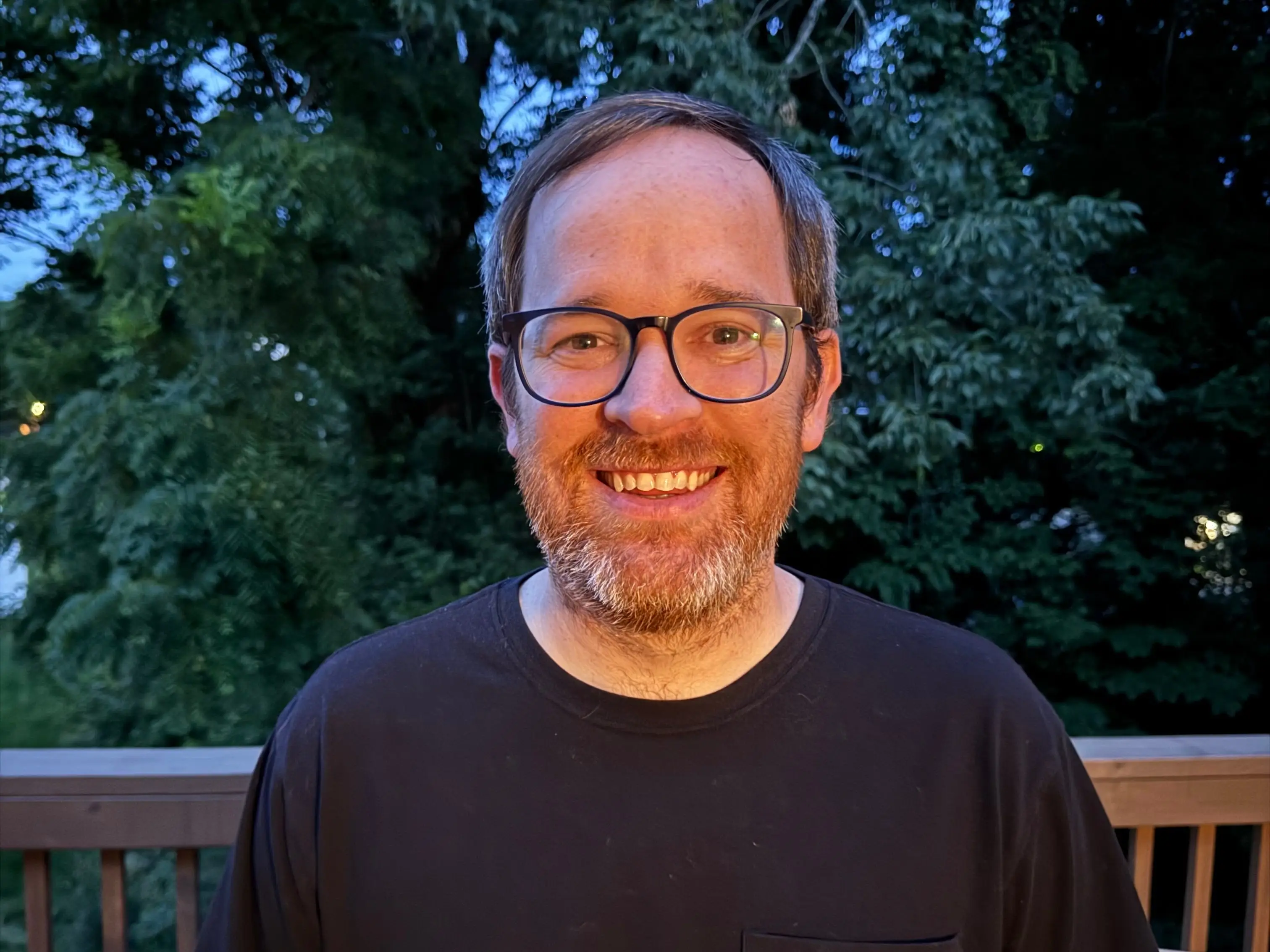 The author poses on a deck outside.