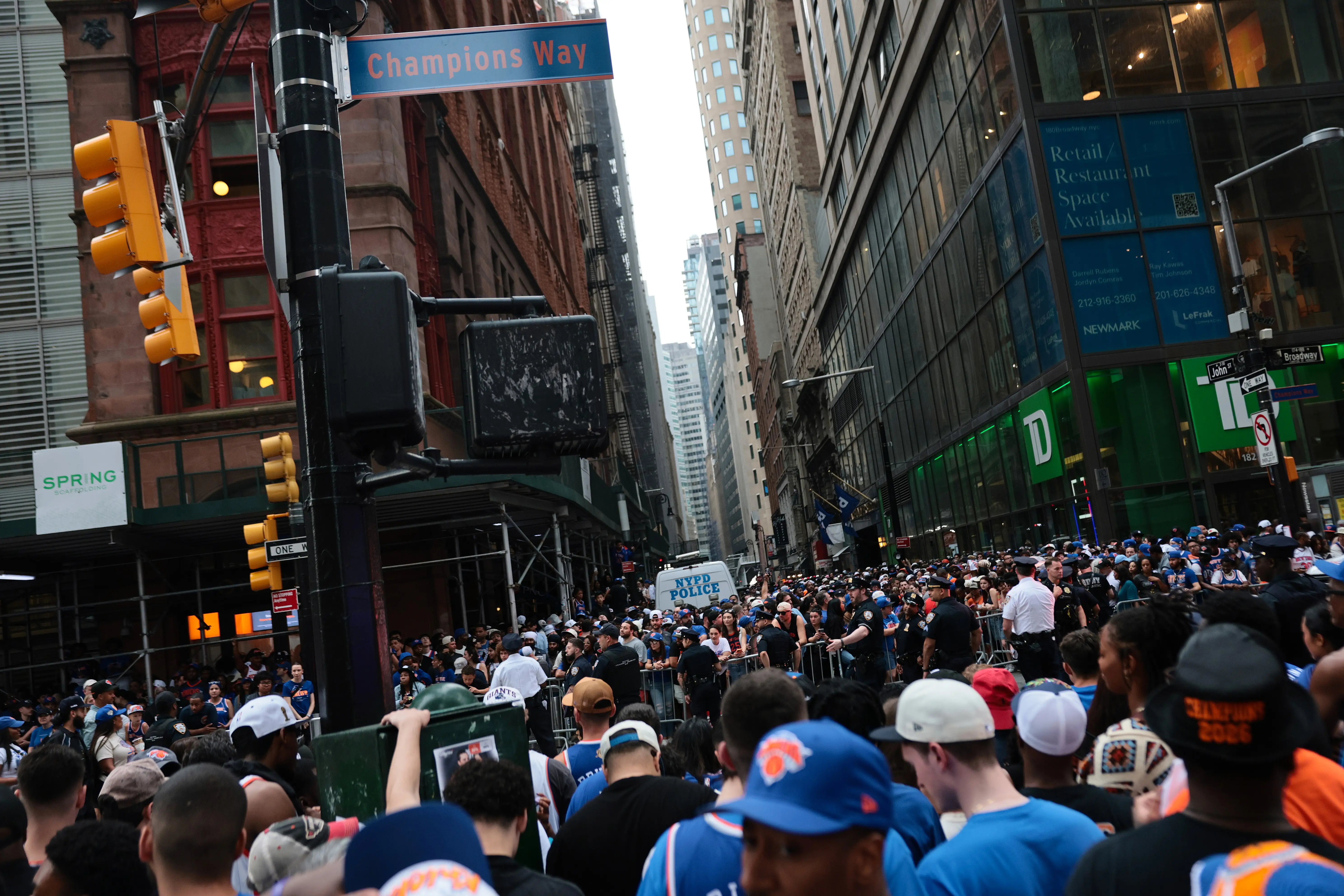 Fans gathered between skyscrapers to attend the Knicks ticker tape parade.