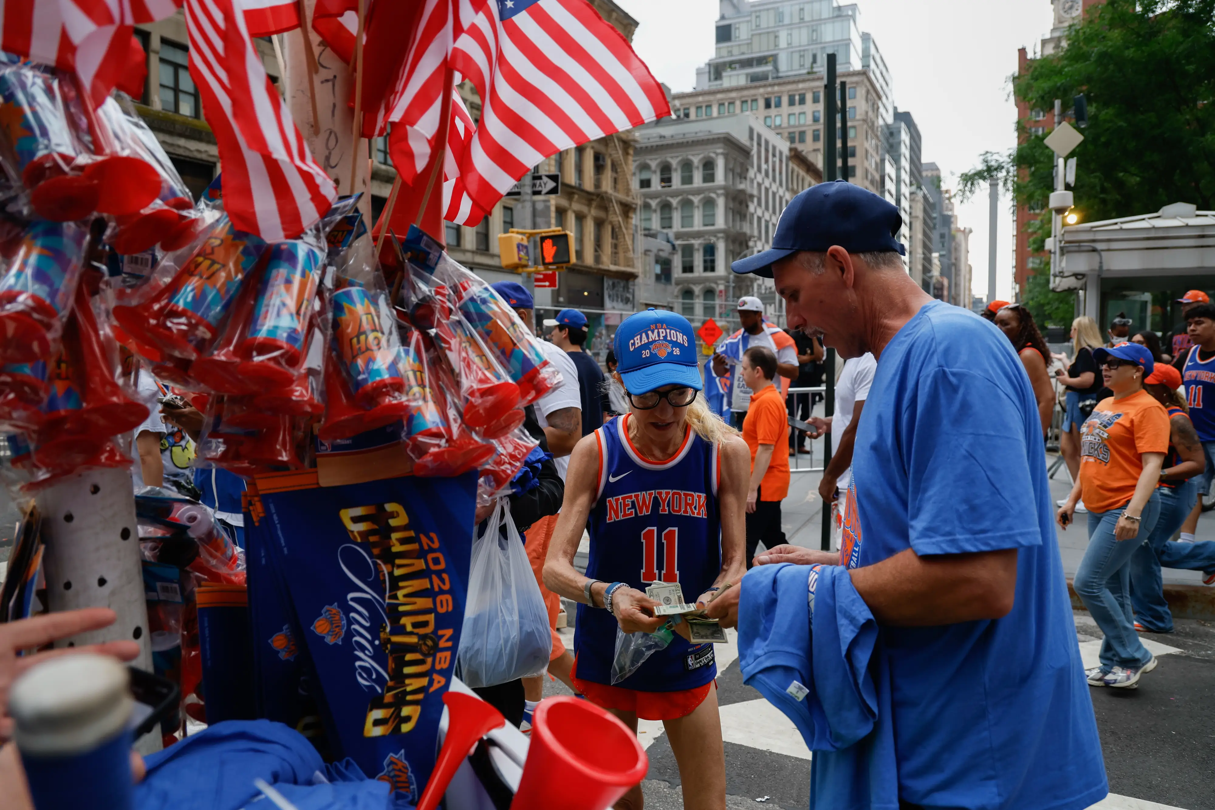 A vendor sold merchandise near the Knicks parade.