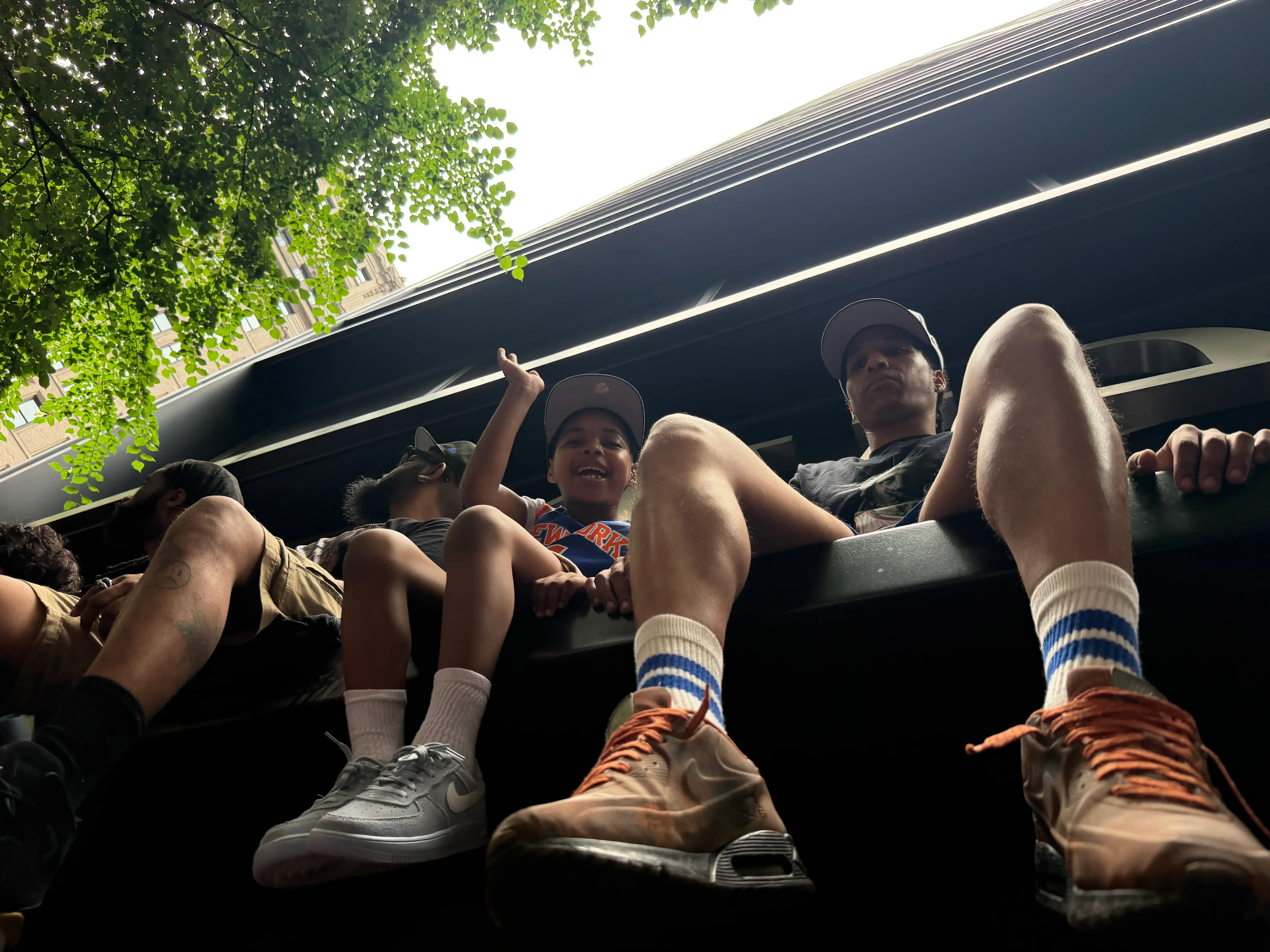 Kid sitting on building ledge outside the Business Insider office