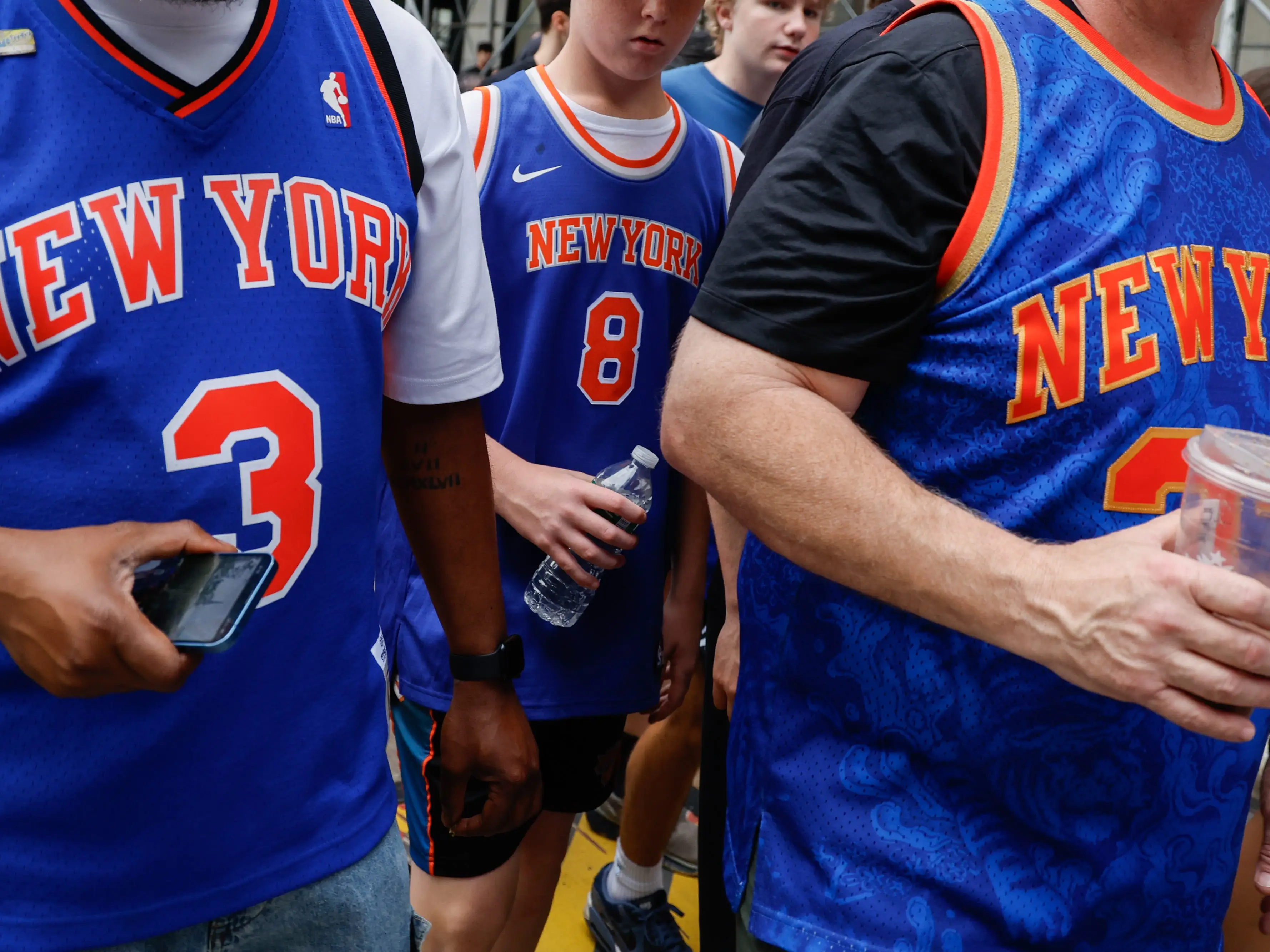 Fans arrive ahead of a ticker-tape parade to celebrate the New York Knicks' NBA Championship win, in New York, US, on Thursday, June 18, 2026. T