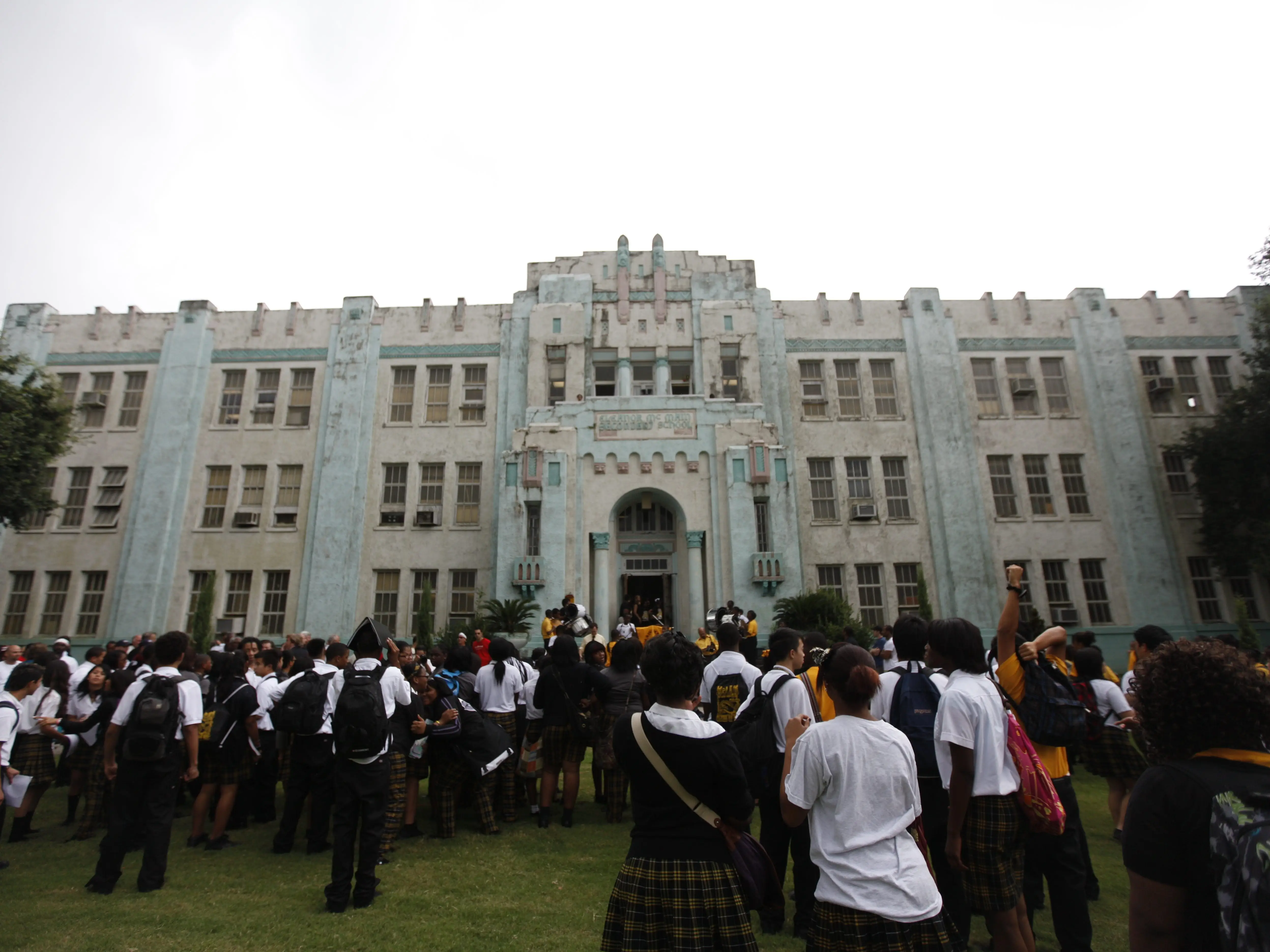 students outside McMain High School in New Orleans, Louisiana.