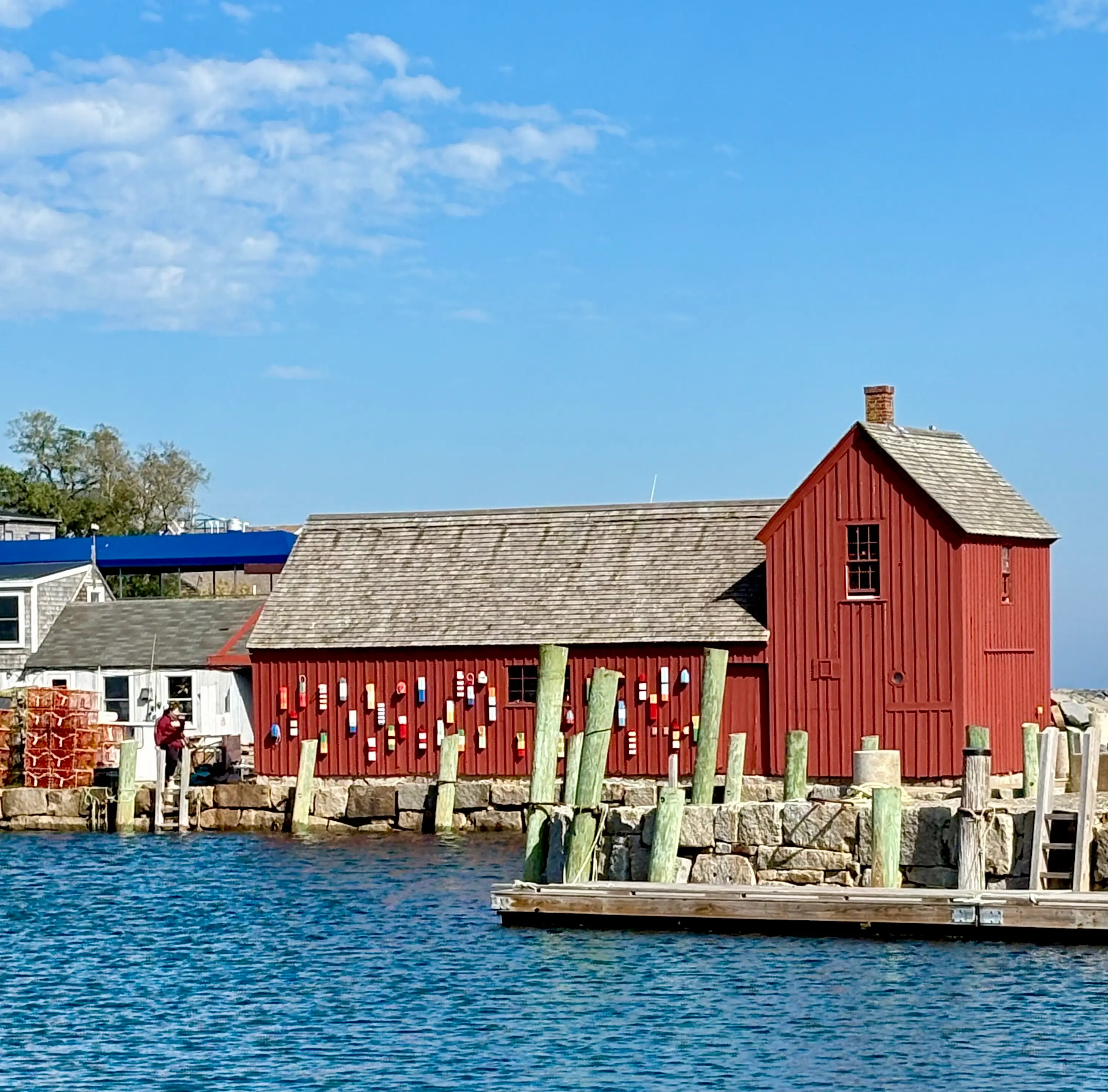 View of red fishing shack along water in Rockport, Massachusetts