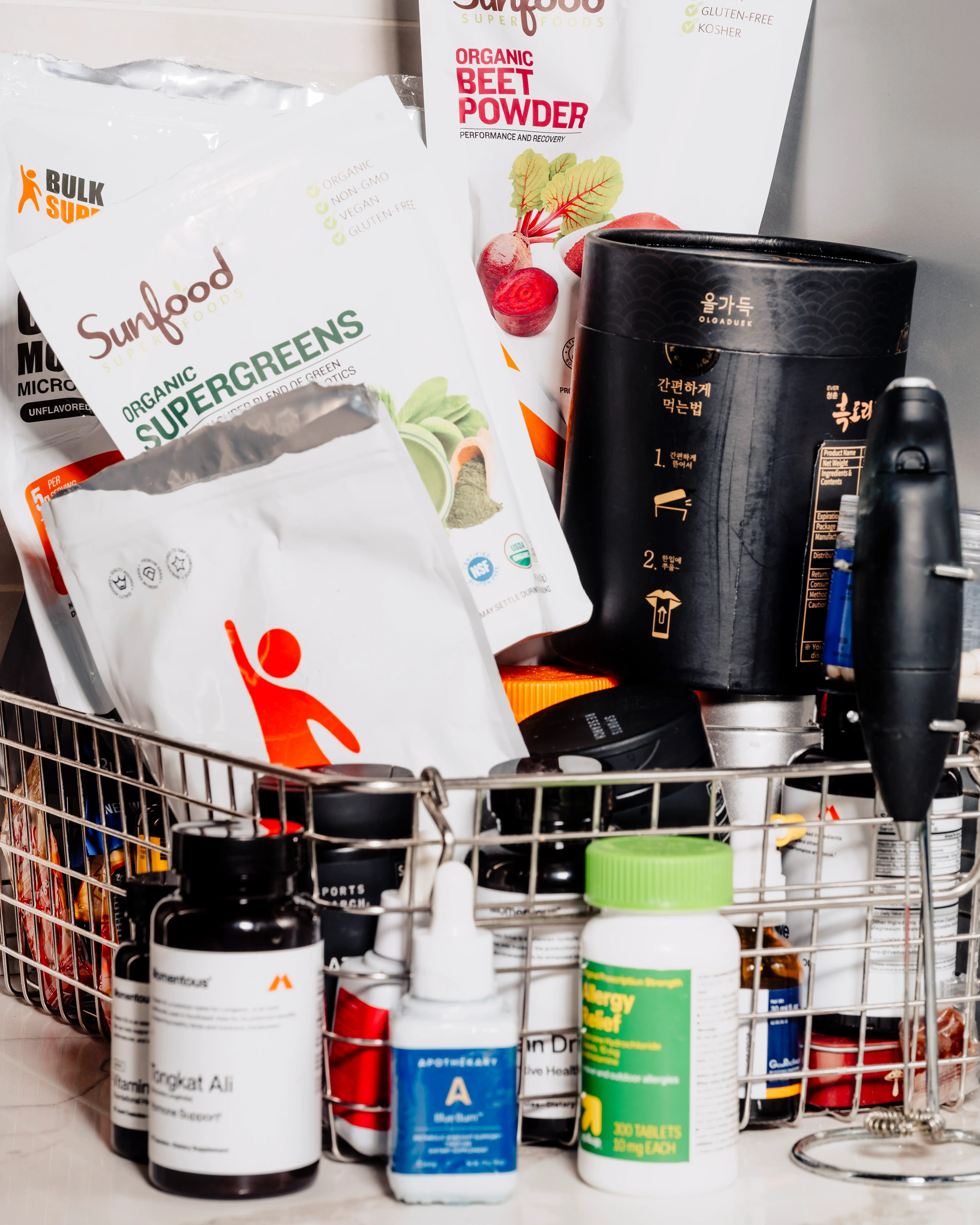 Supplement packets and bottles in a basket.