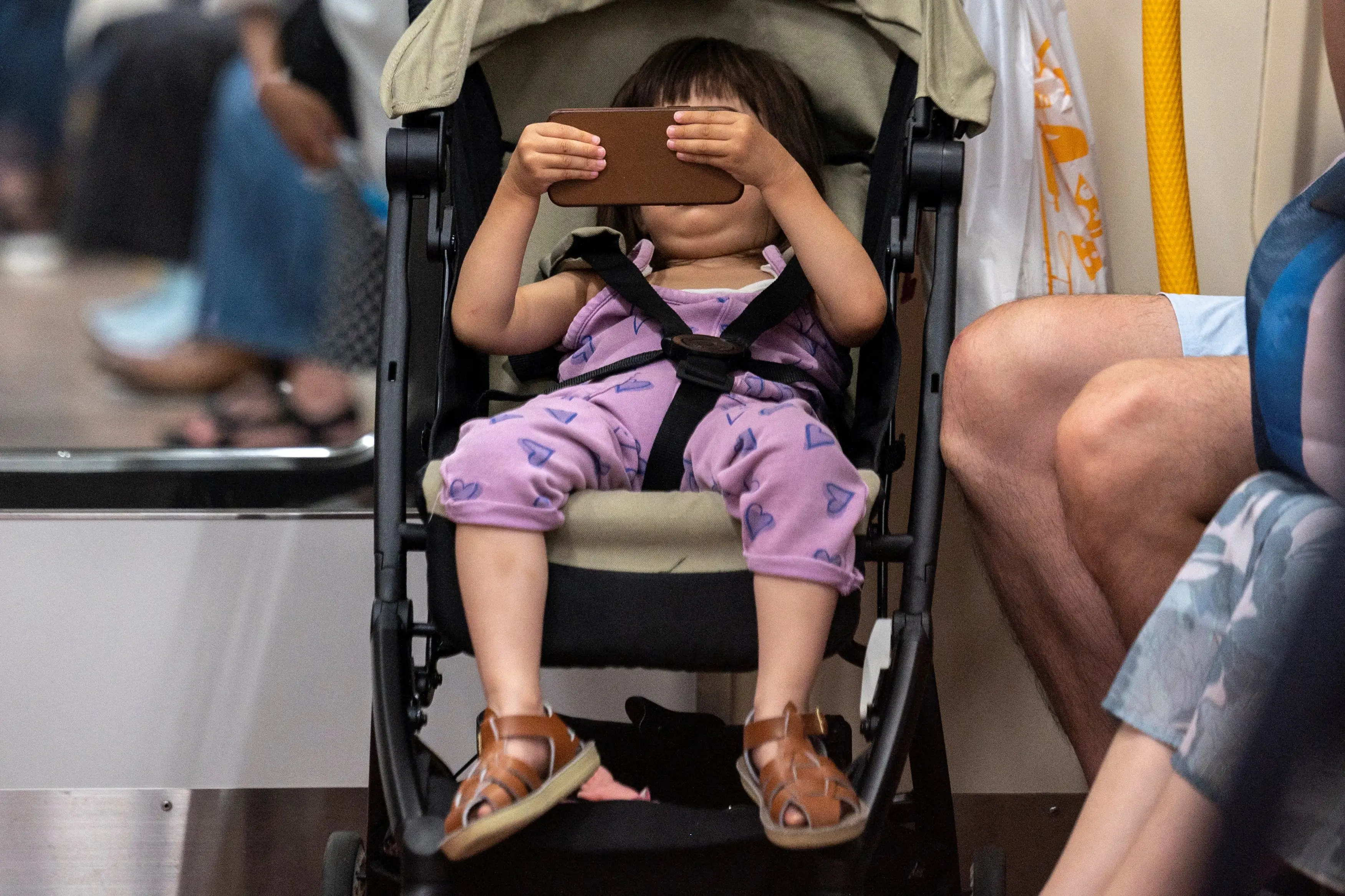 a toddler on a phone