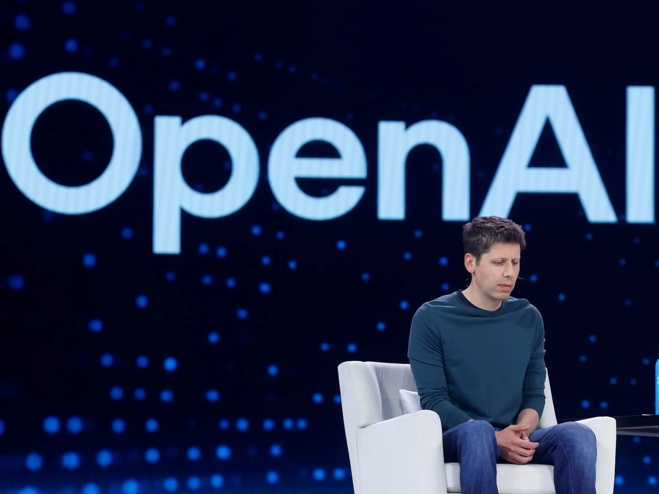 Sam Altman looks down during an OpenAI event