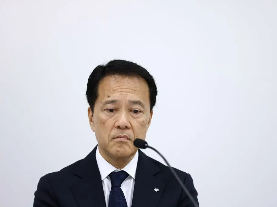 Kentaro Okuda, CEO of Nomura Holdings, looking down.