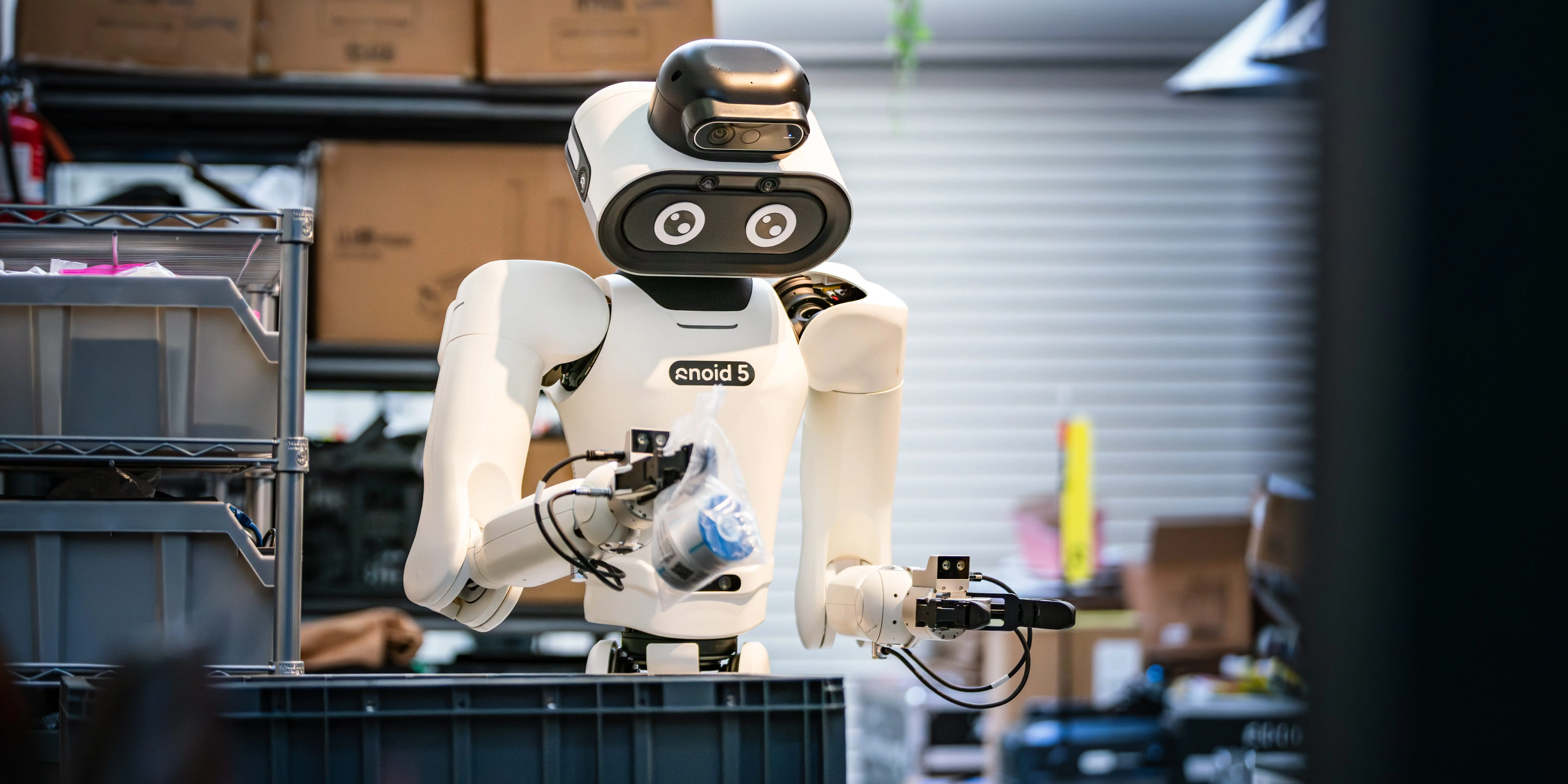 A humanoid picking up an object.