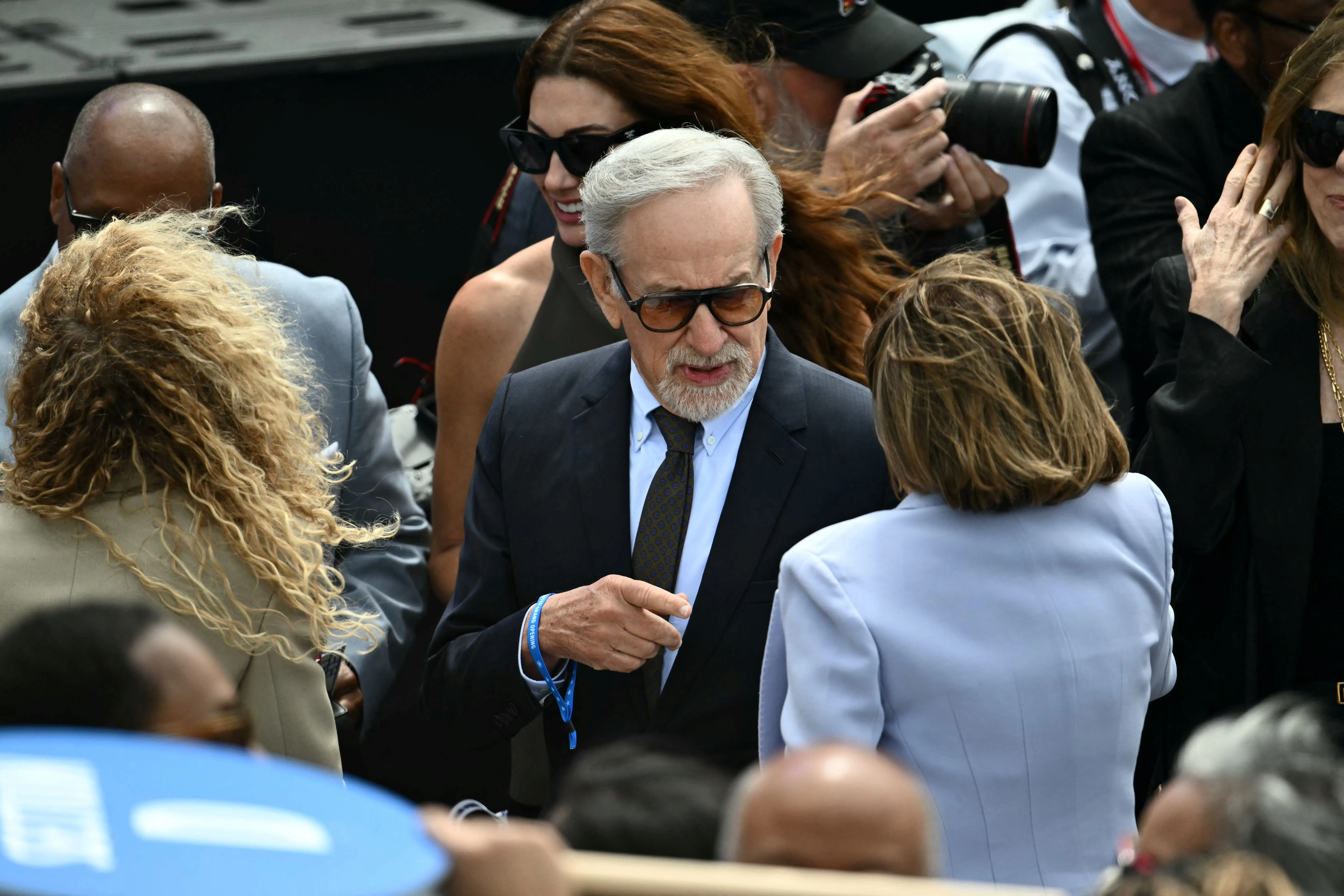 Steven Spielberg speaks with Rep. Nancy Pelosi during the opening of the Barack Obama Presidential Center.