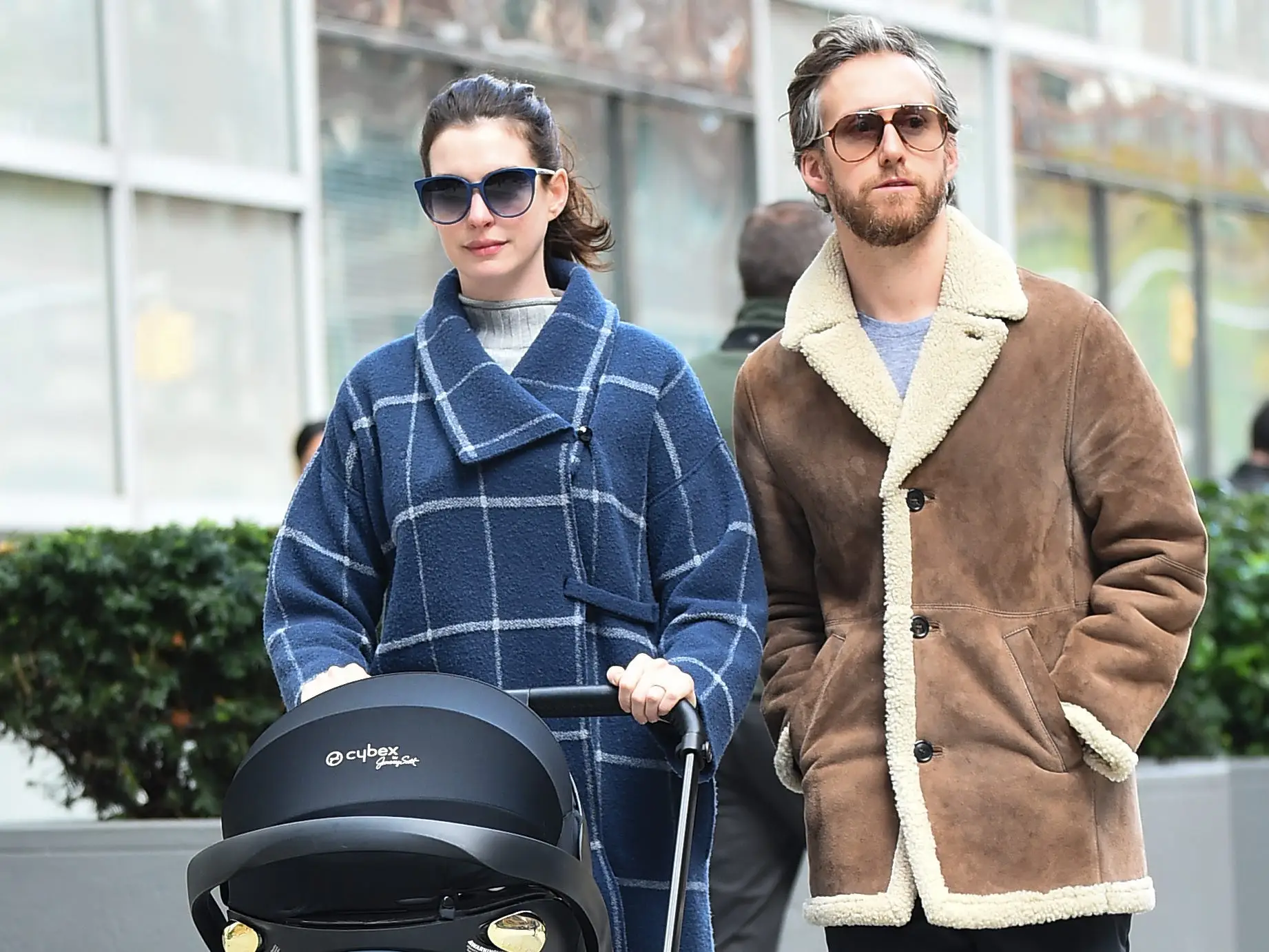 Anne Hathaway and Adam Shulman pushing their son in a stroller