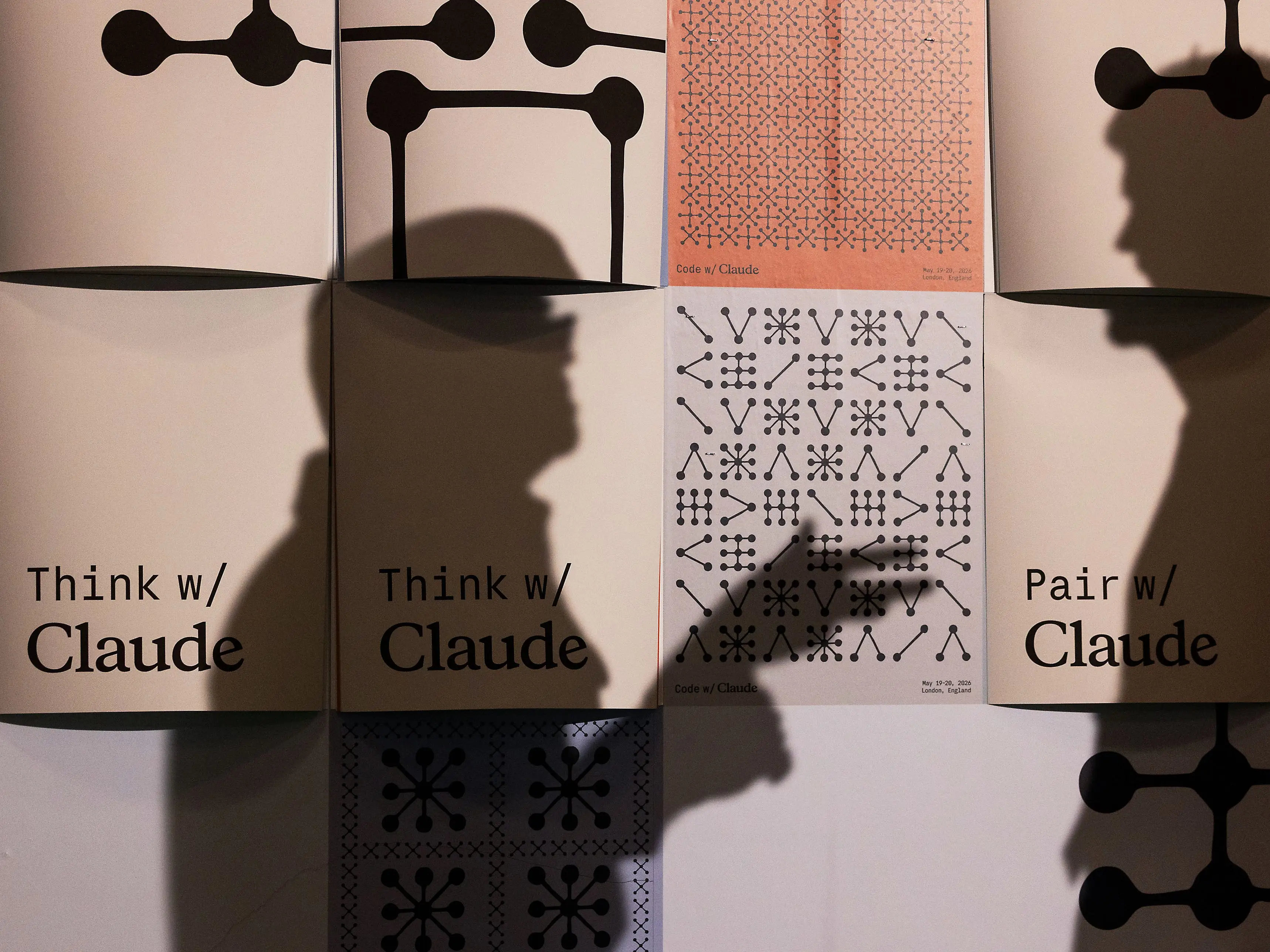 Branding for Claude Code on removable posters at Anthropic PBC's Code with Claude developer conference.