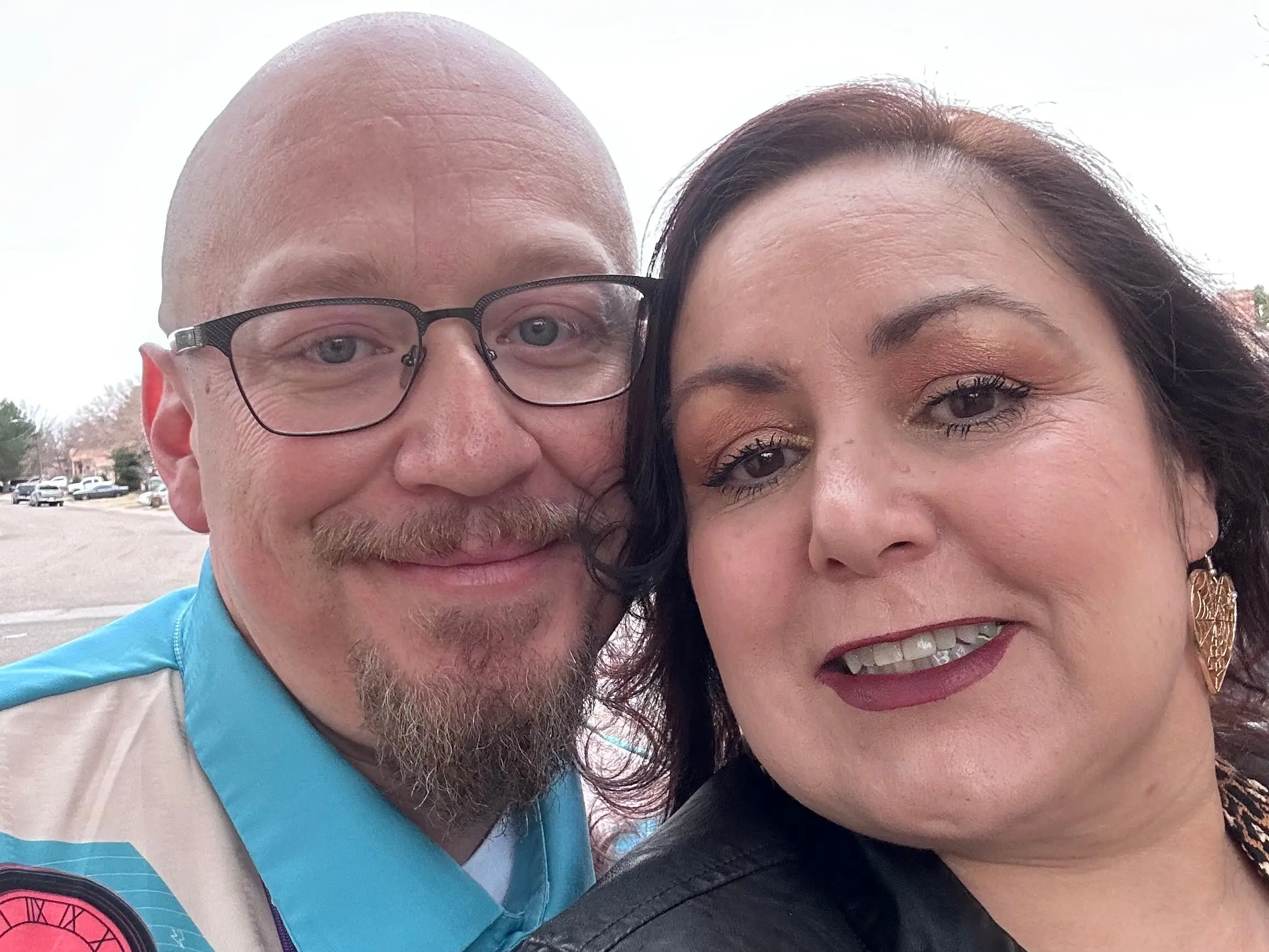 A man and woman taking a selfie.