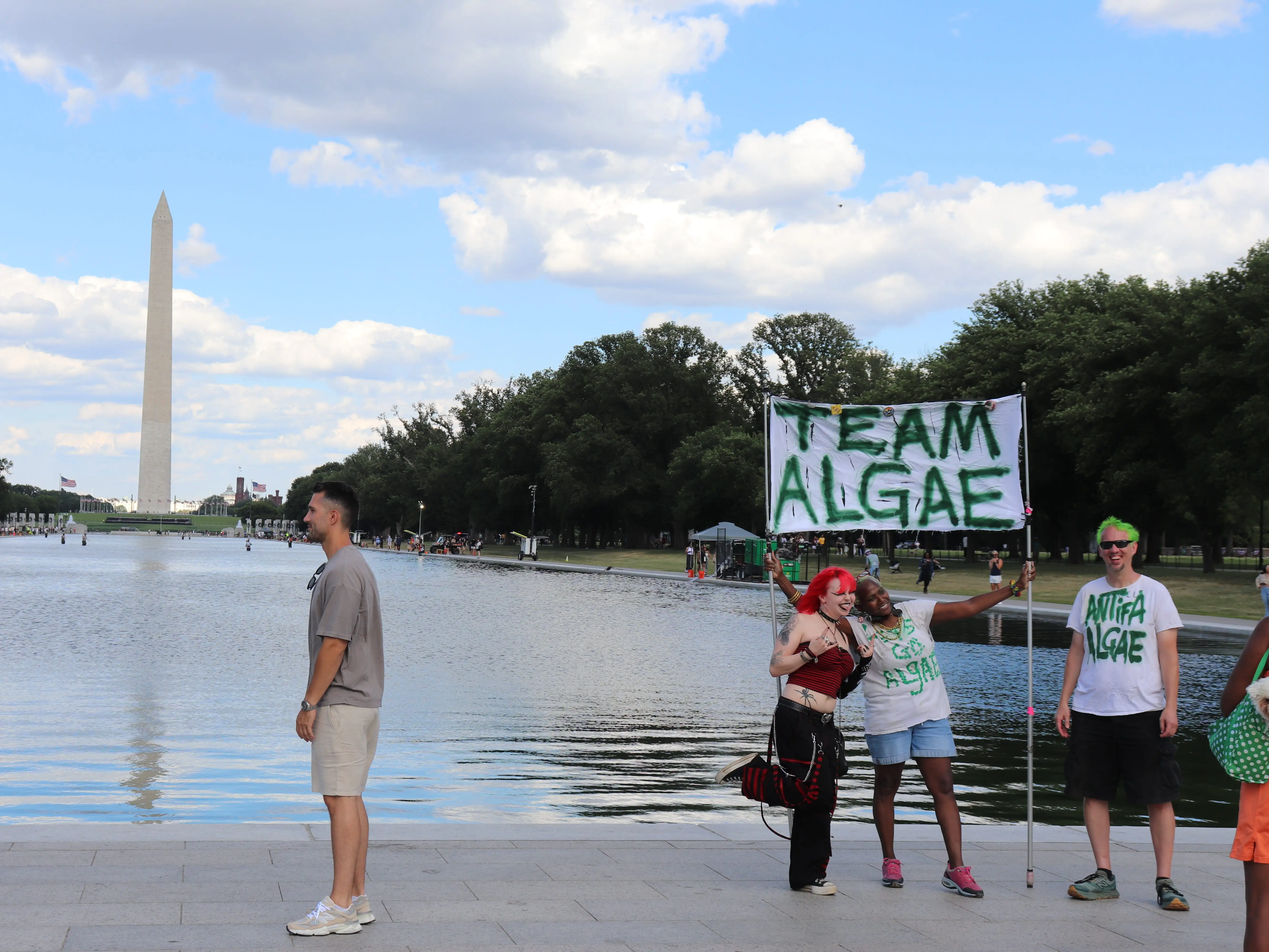 Visitors and protesters at the Reflecting Pool in Washington, DC, on June 19, 2026