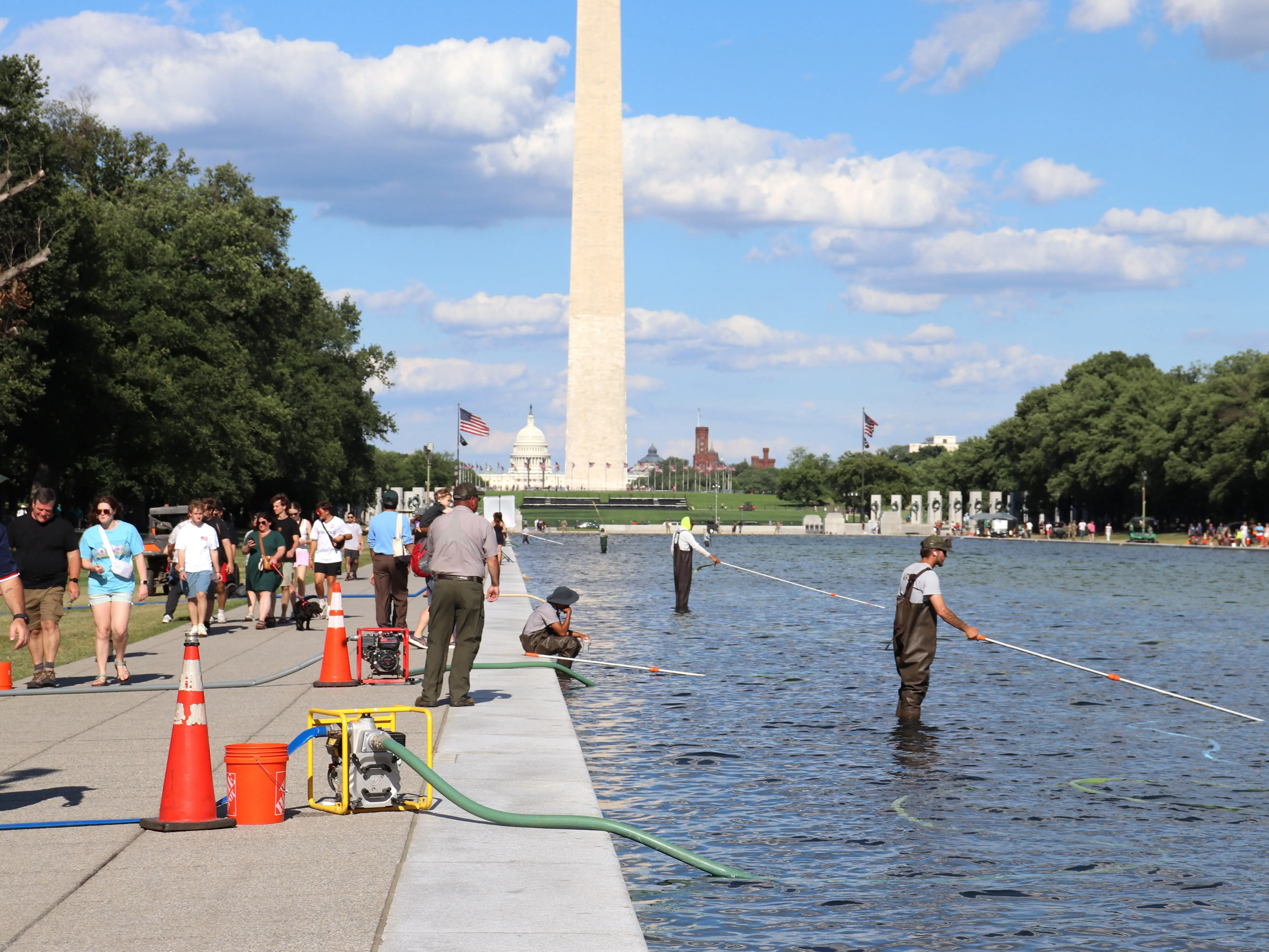 National Park Service worker cleaning reflecting pool in Washington, DC, on June 19, 2026
