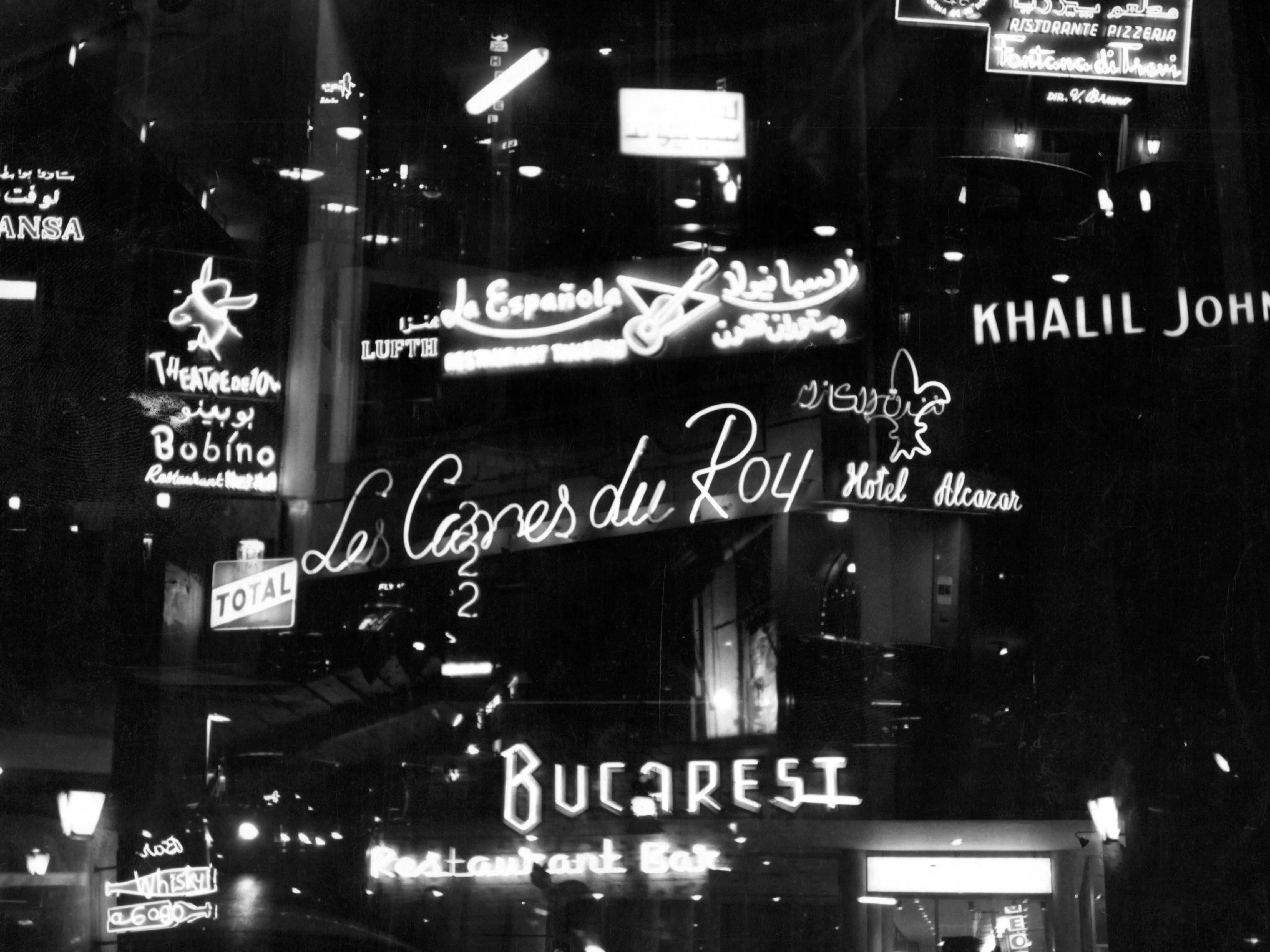 Illuminated signage displayed in many colors and languages across the city to attract the night life crowd in Beirut Lebanon, 1955
