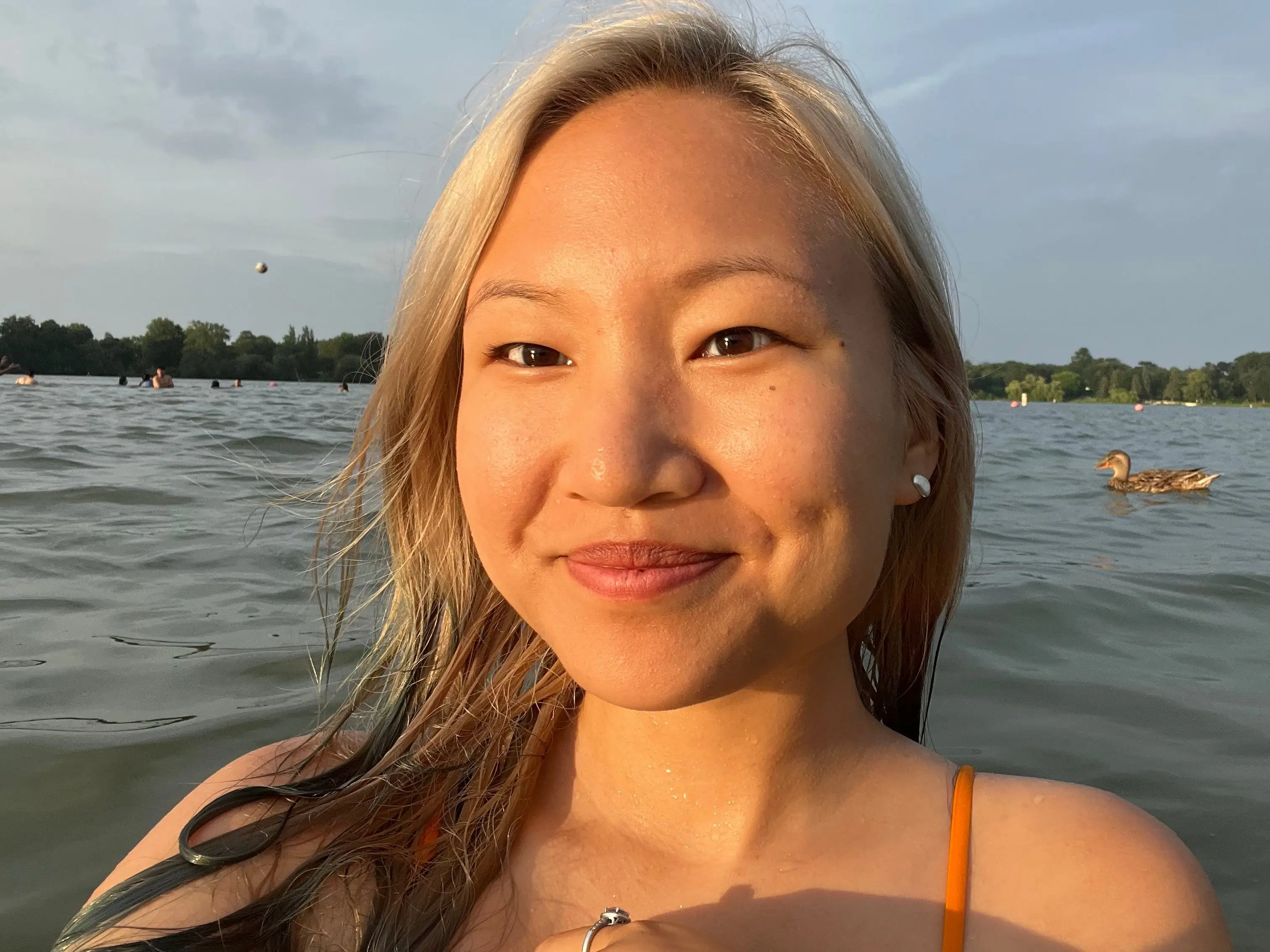 Dana swims with ducks in Lake Nokomis.