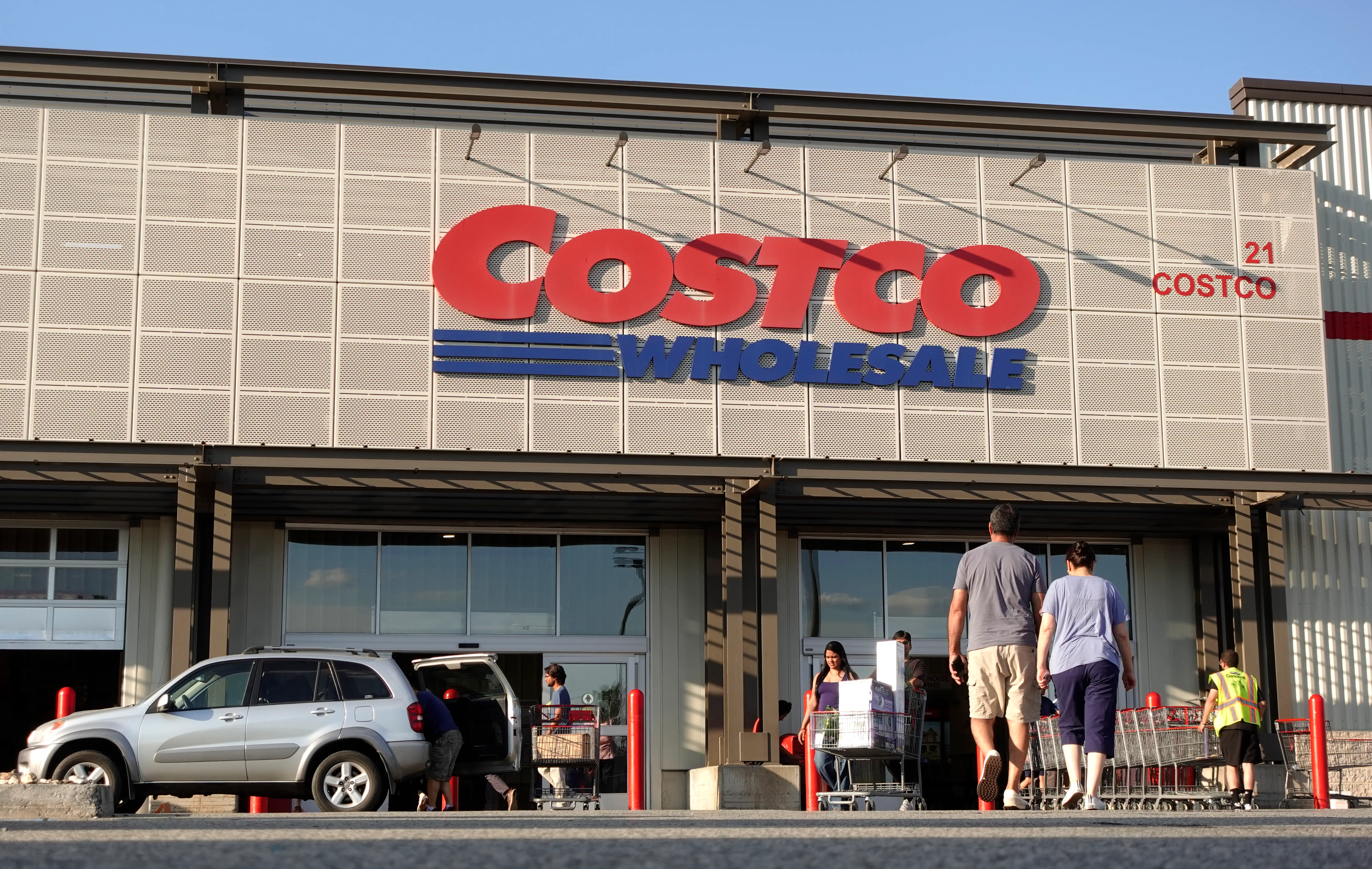 Exterior of a Costco with people out front
