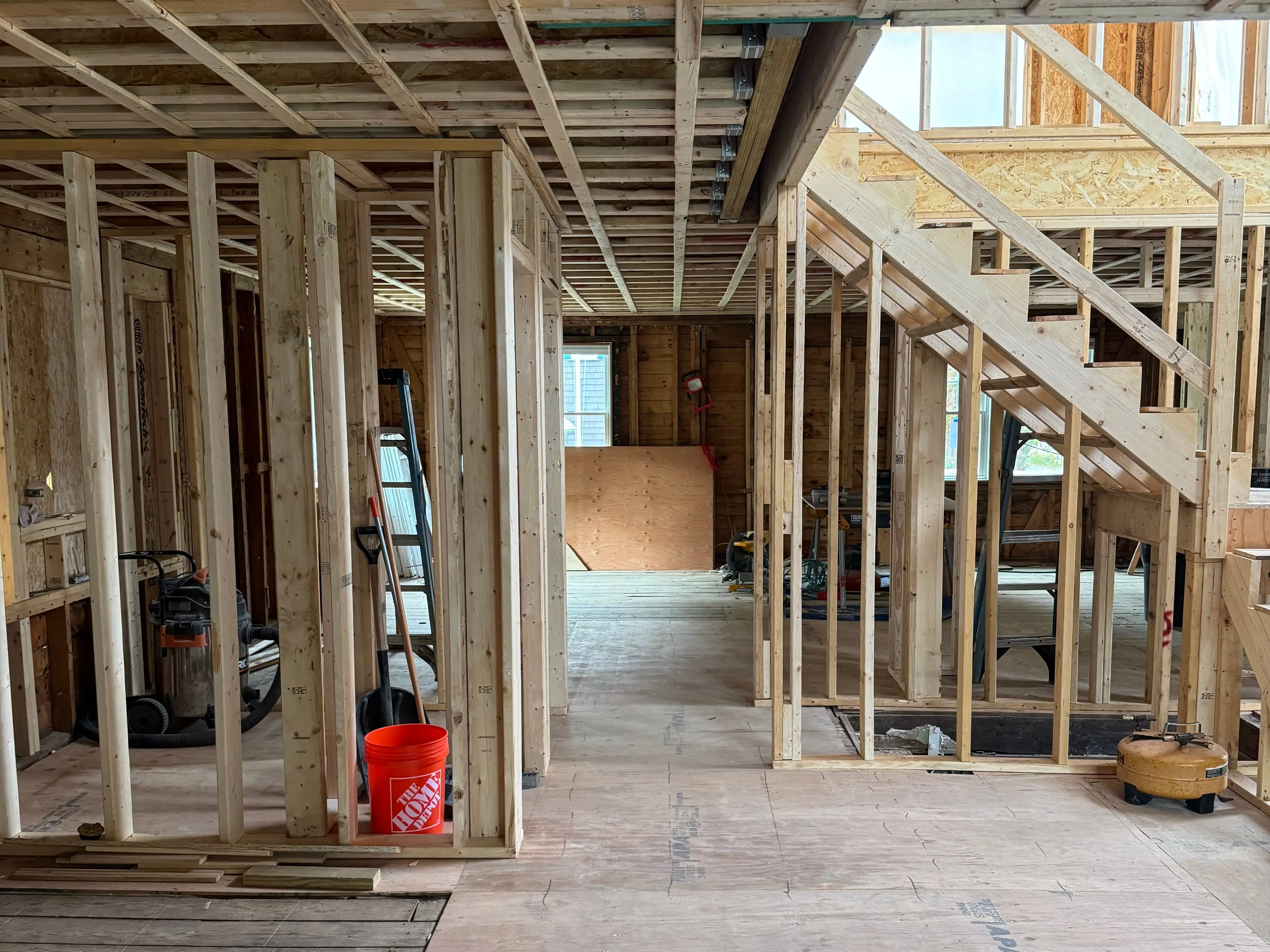 A house under construction. It doesn't have walls or finished floors.