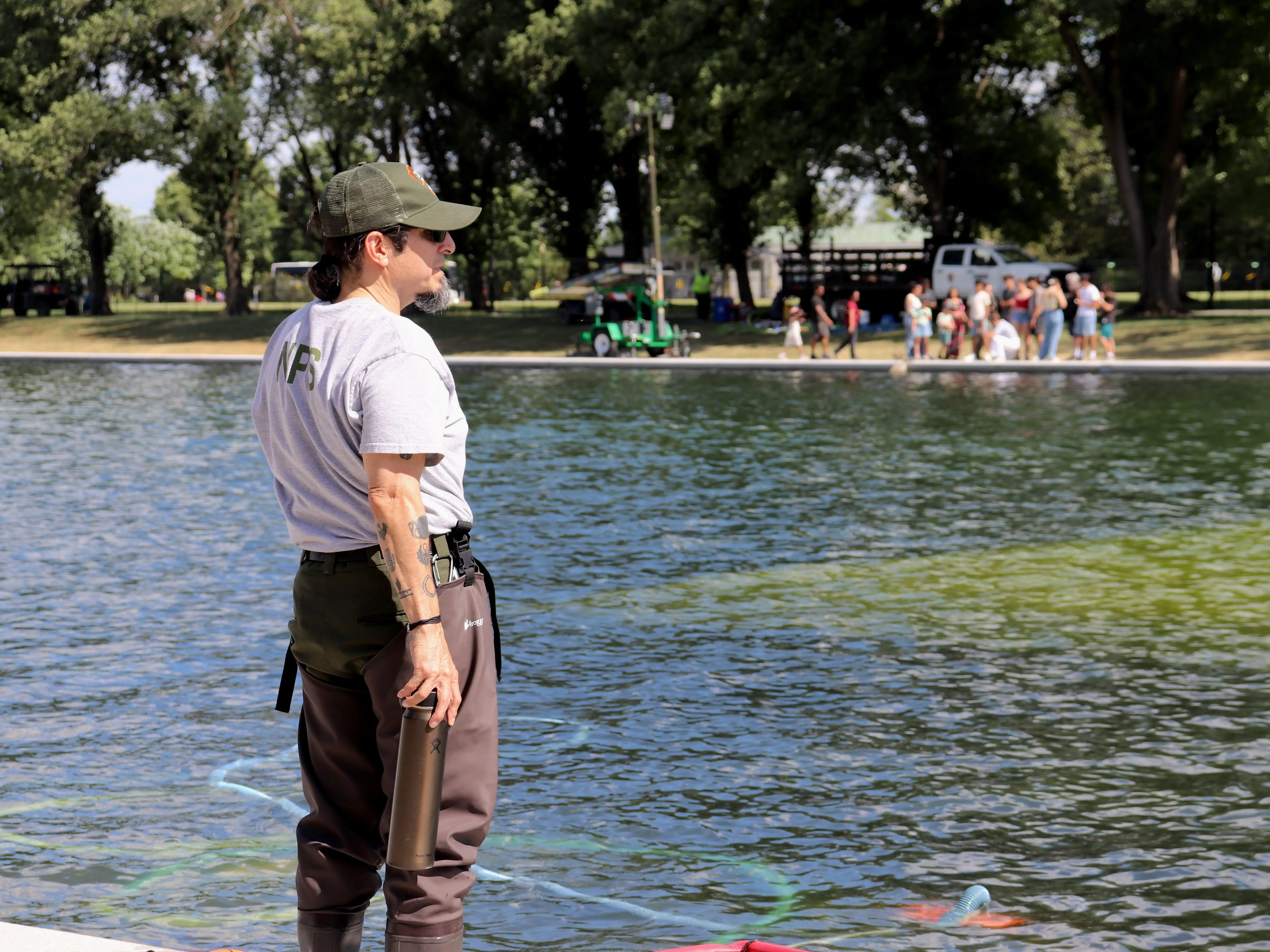 National Park Service worker cleaning reflecting pool in Washington, DC, on June 19, 2026