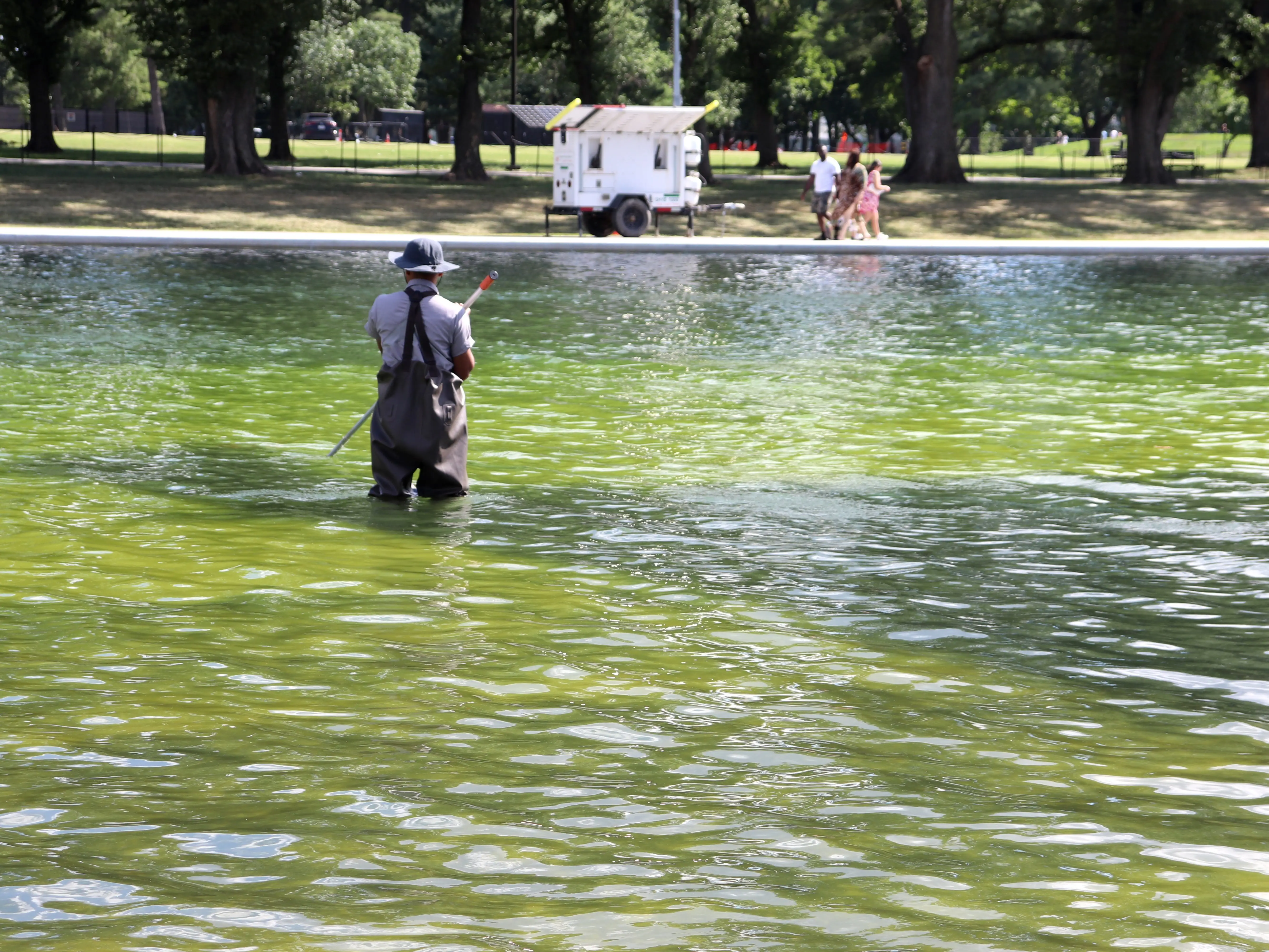 National Park Service worker cleaning reflecting pool in Washington, DC, on June 19, 2026