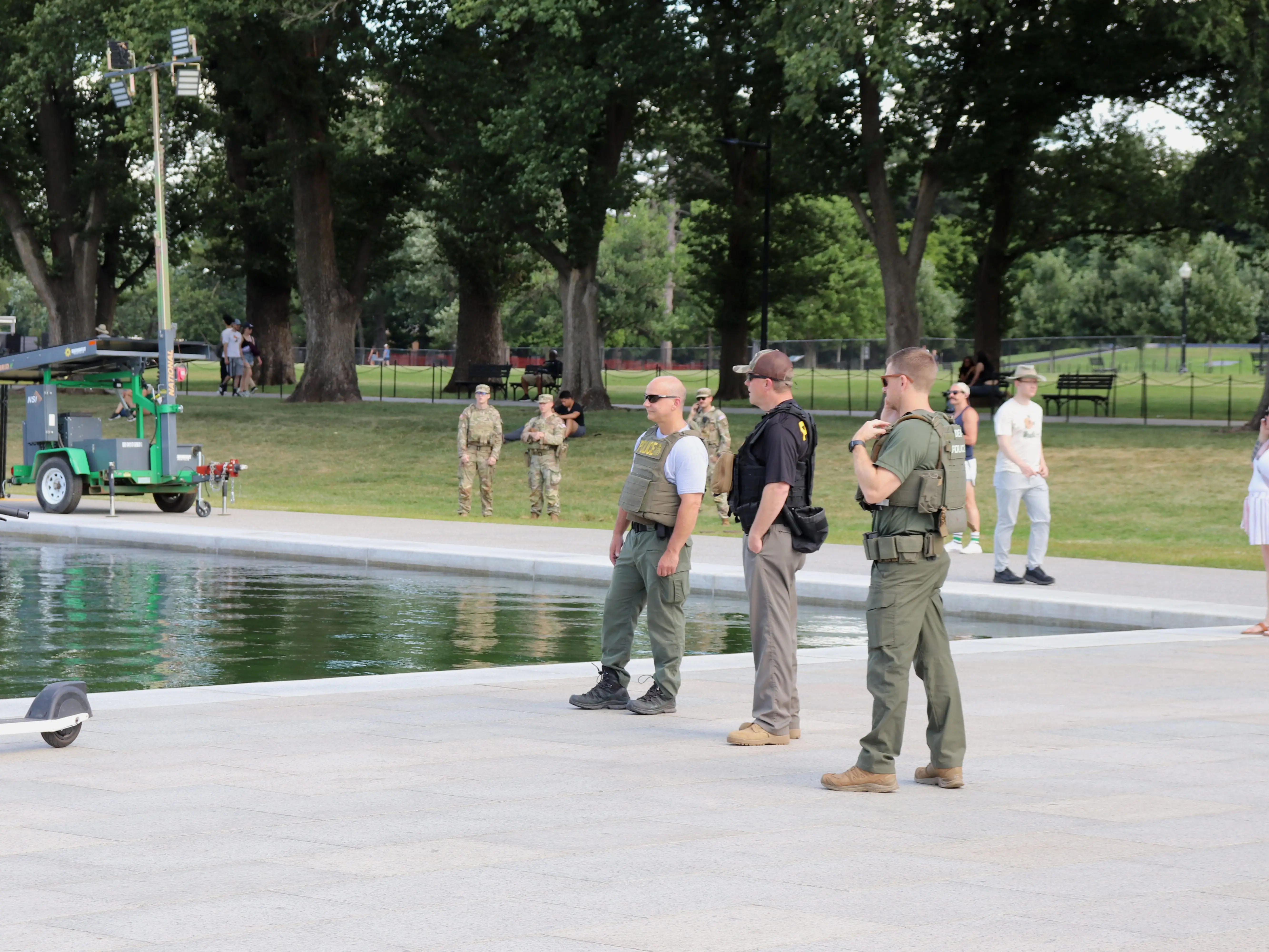 Police and national guardsmen at the reflecting pool in Washington, DC, on June 19, 2026