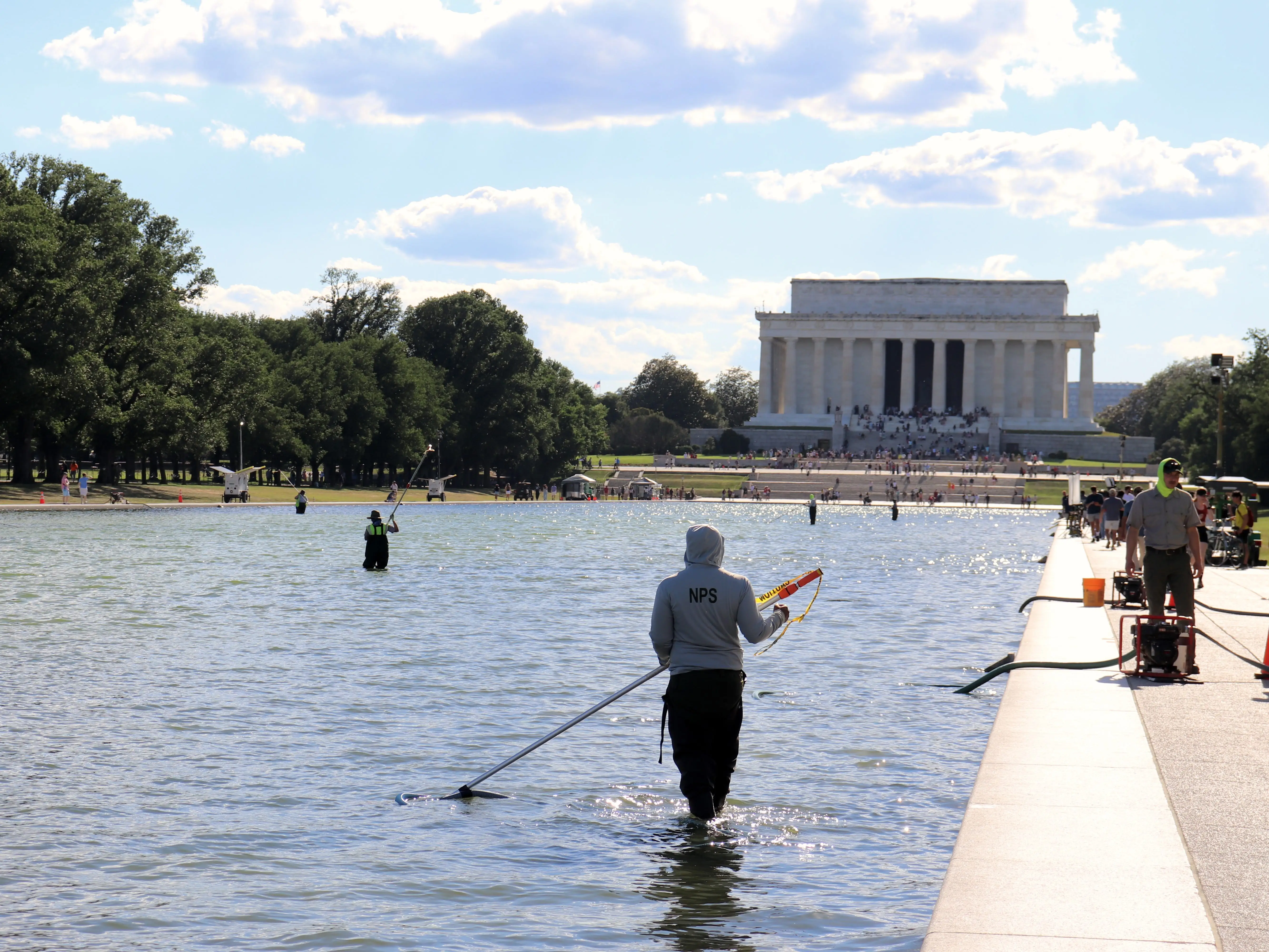 National Park Service worker cleaning reflecting pool in Washington, DC, on June 19, 2026
