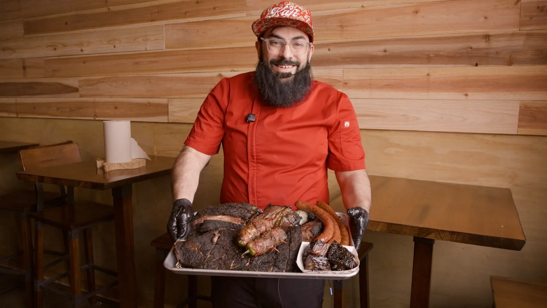 Abdul-Kafi holding a plate of meat.