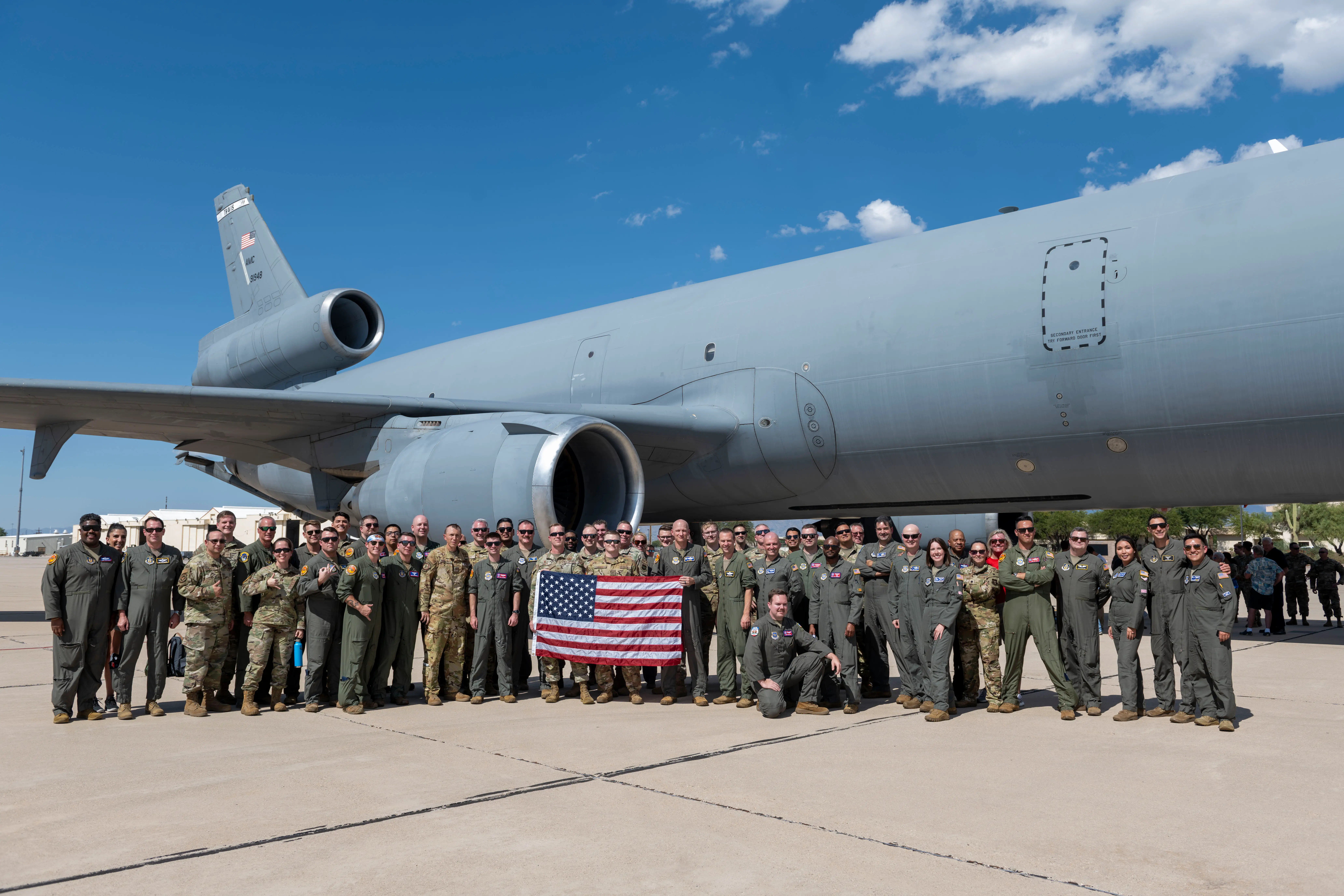 US Air Force service members with the last KC-10 Extender after its retirement flight in 2024.
