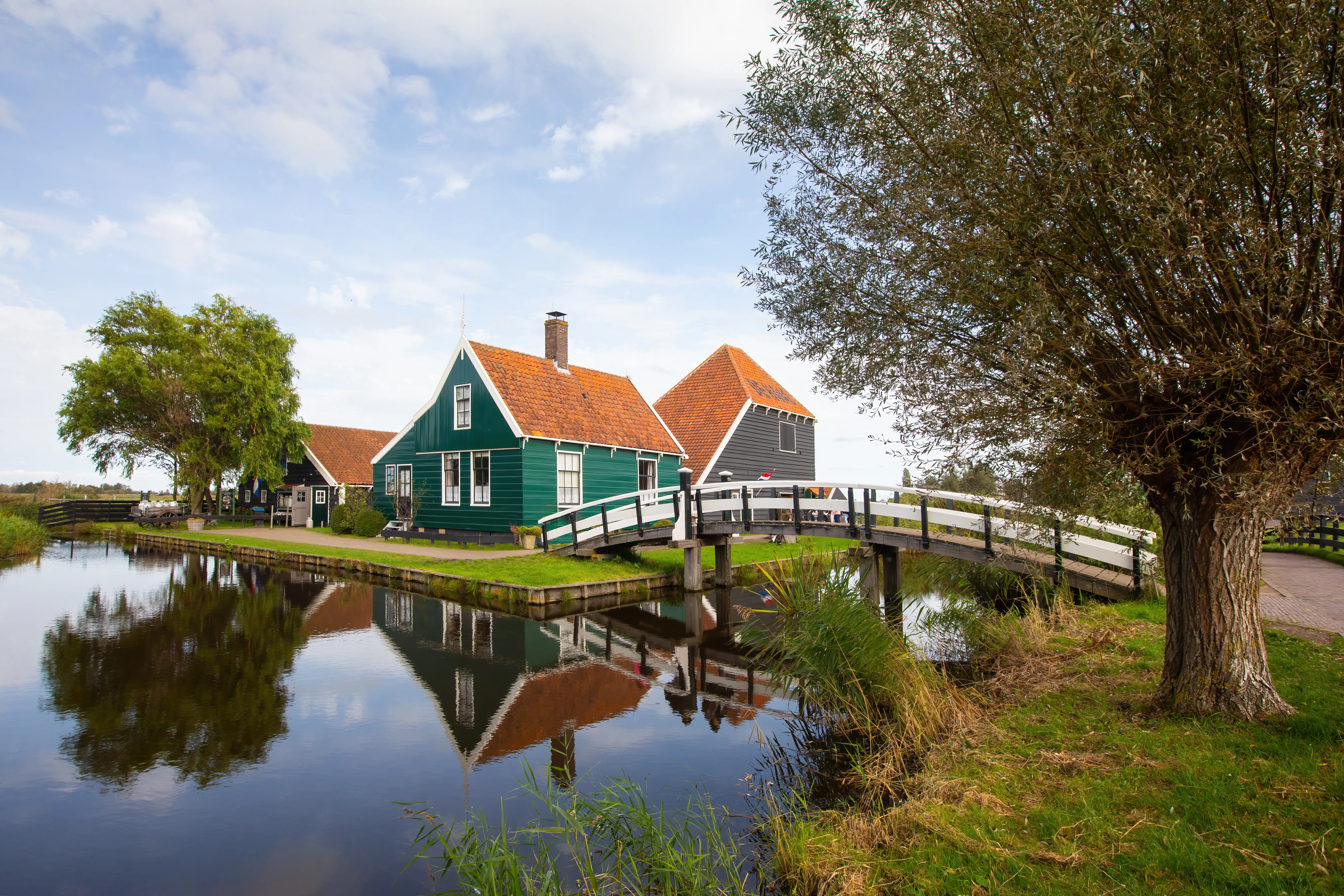 De Haal building and bridge at the canal in Zaanse Schans, Netherlands on a nice warm day