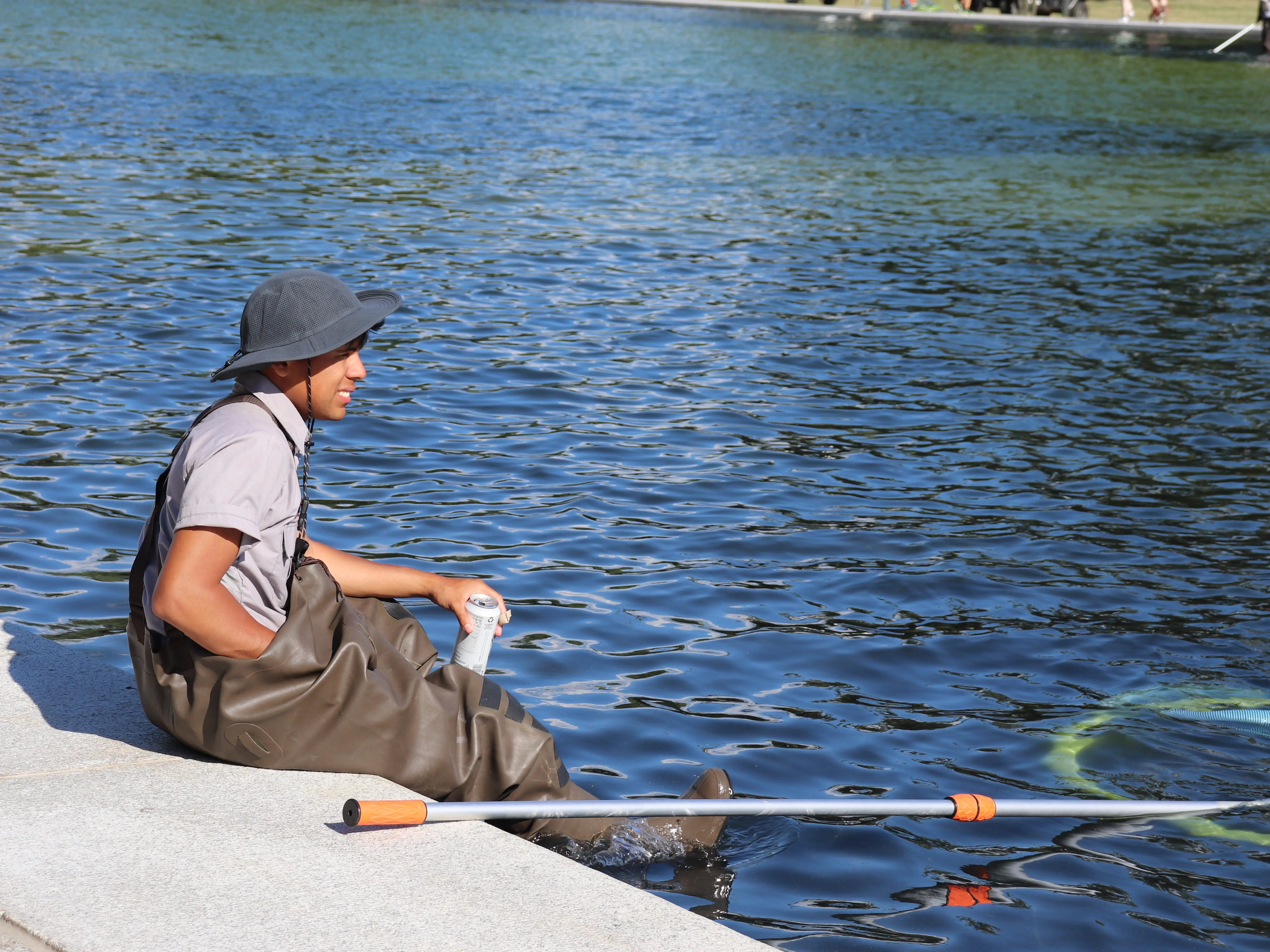 National Park Service worker cleaning reflecting pool in Washington, DC, on June 19, 2026