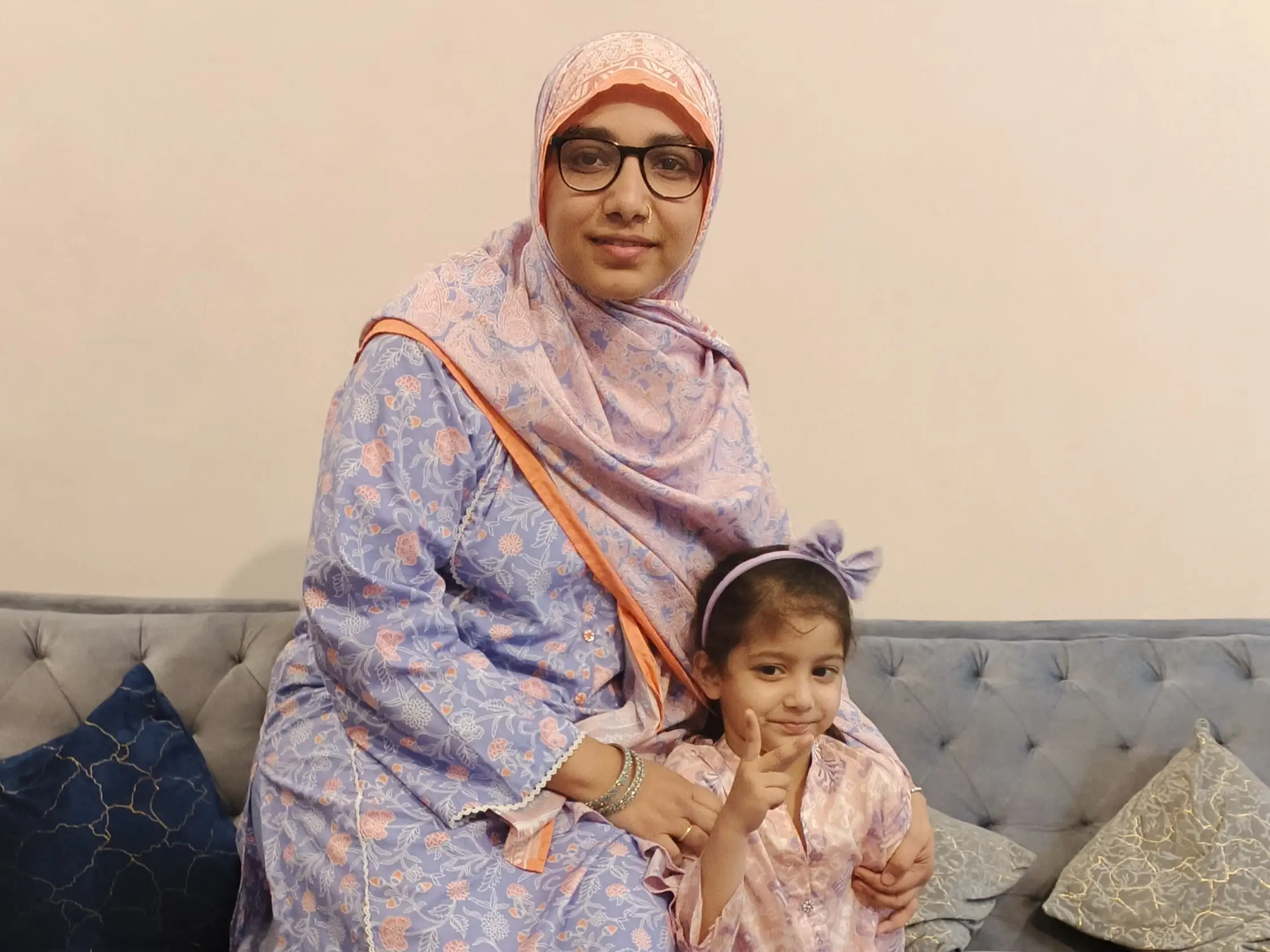 The author and her daughter pose on a couch.