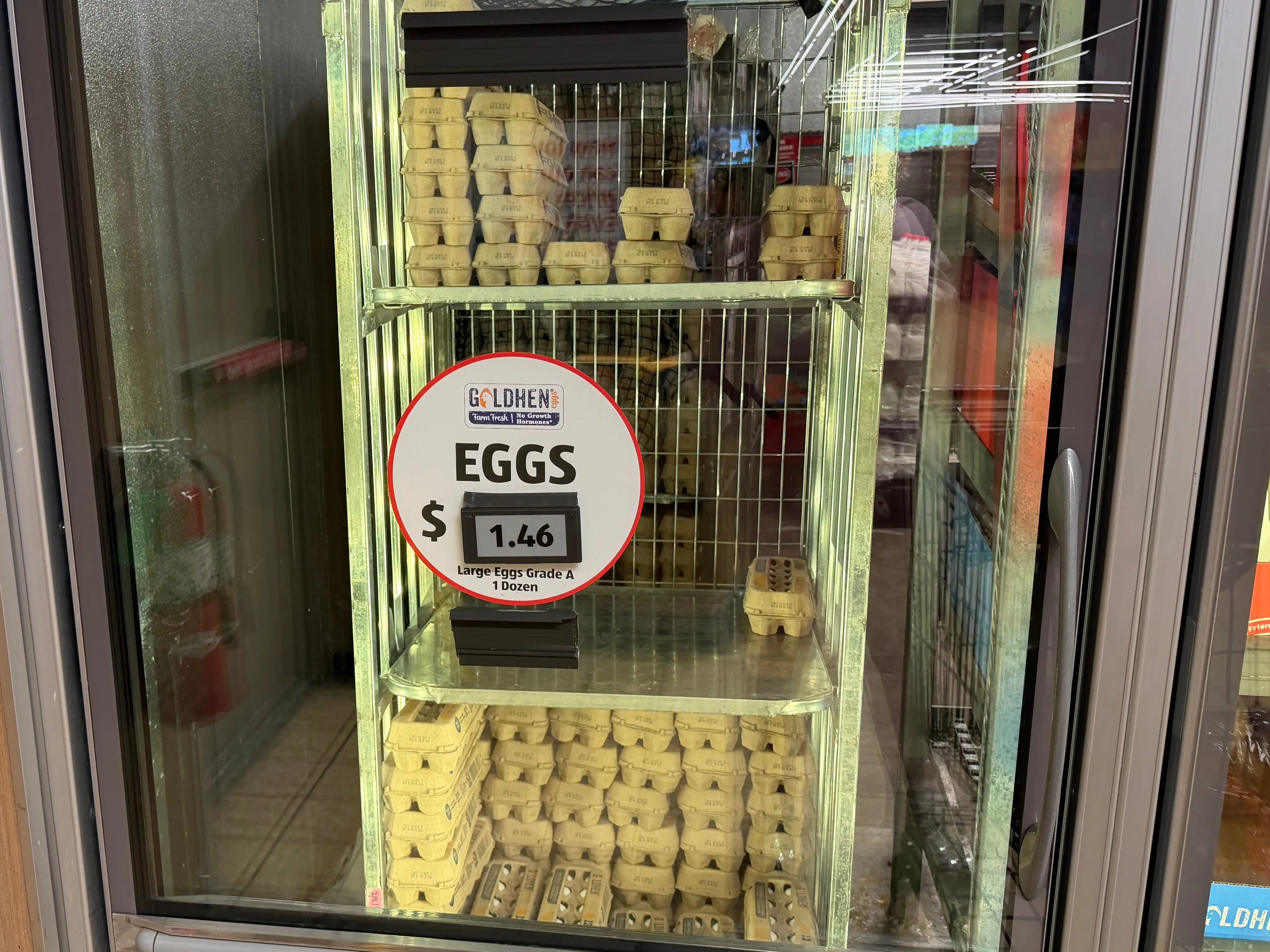 Containers of eggs in a refrigerator at Aldi.