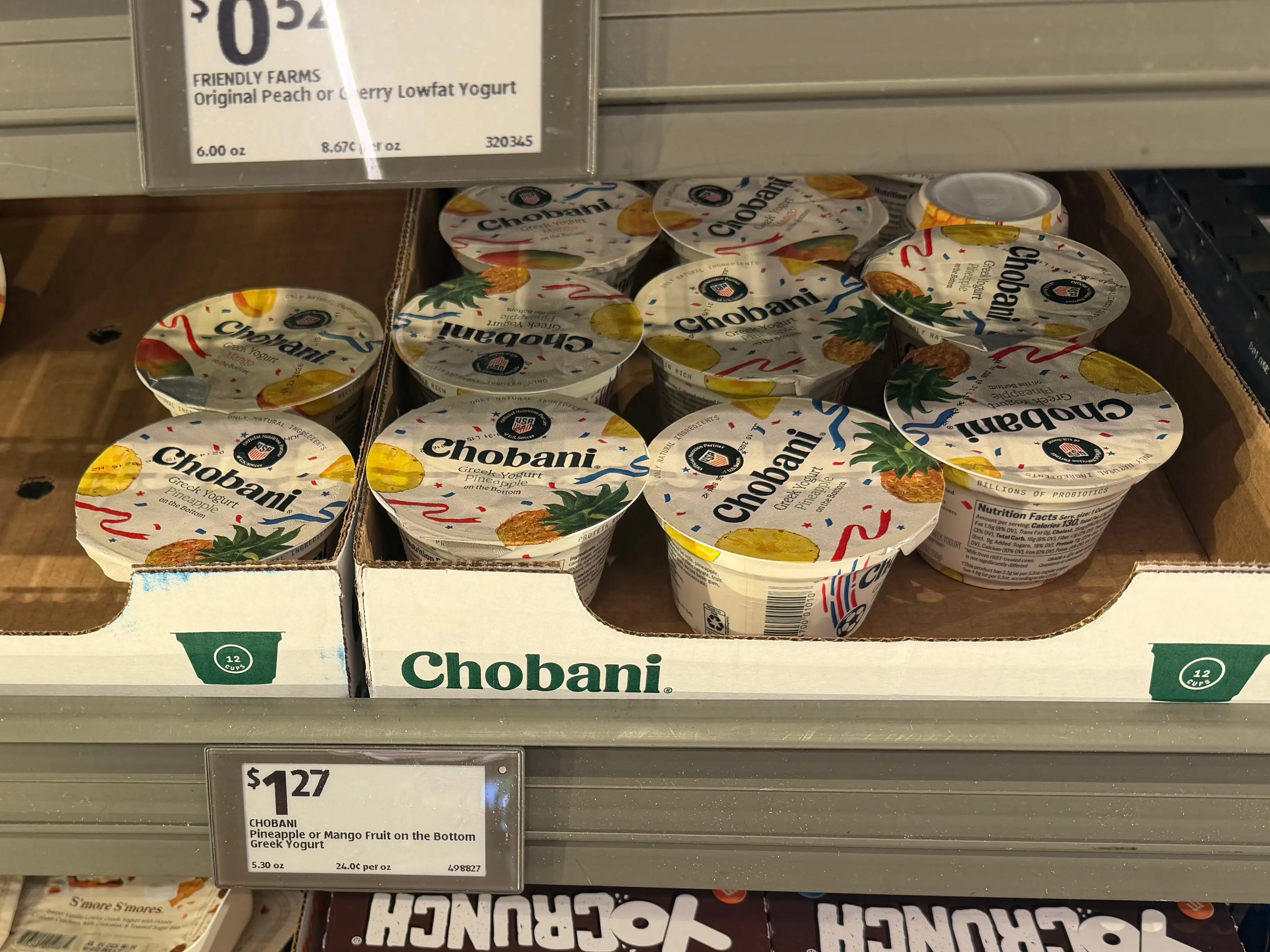 Containers of Chobani yogurt in a refrigerator at Aldi.