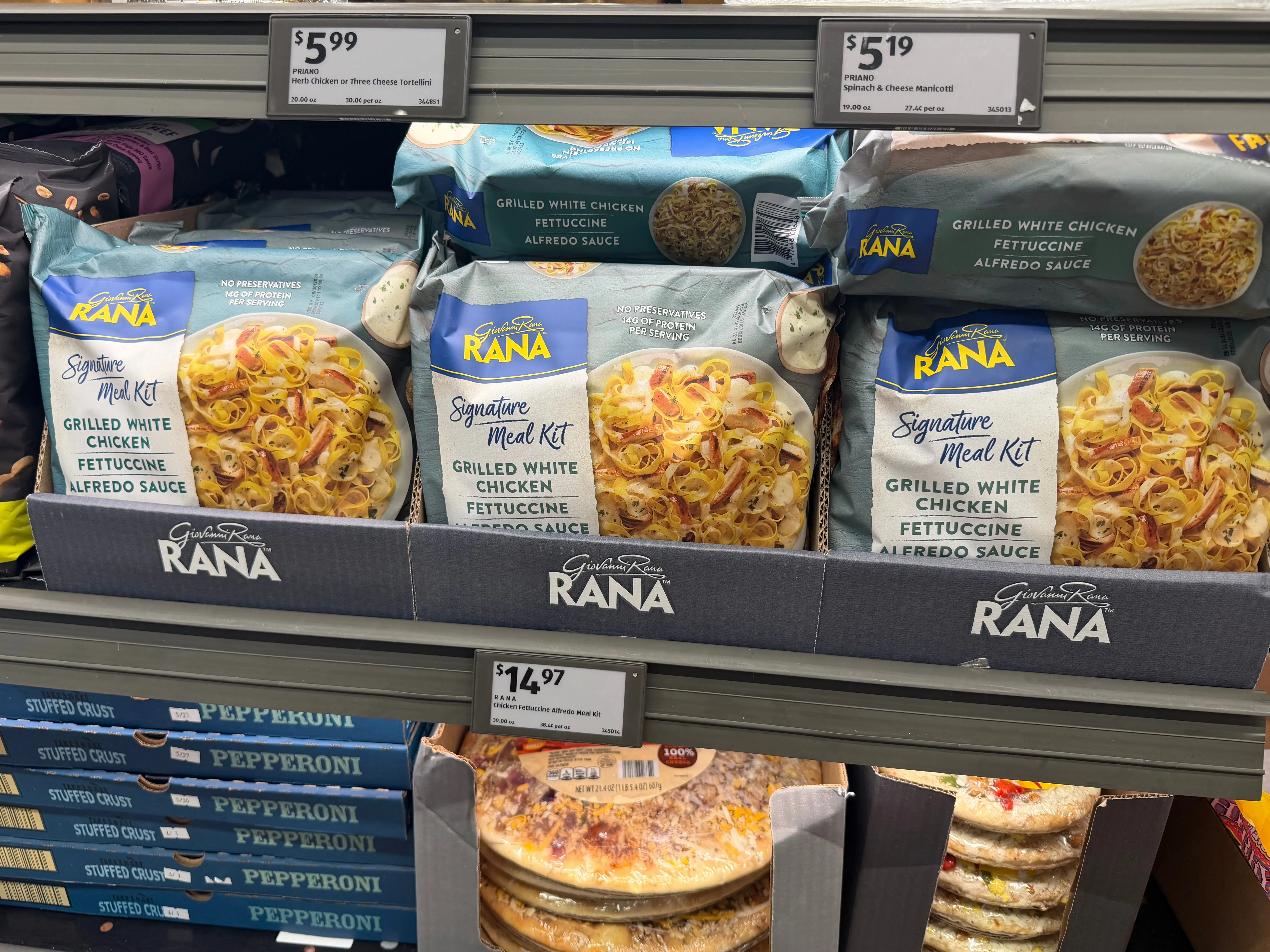 Bags of Giovanni Rana chicken fettuccine Alfredo in a freezer at Aldi.