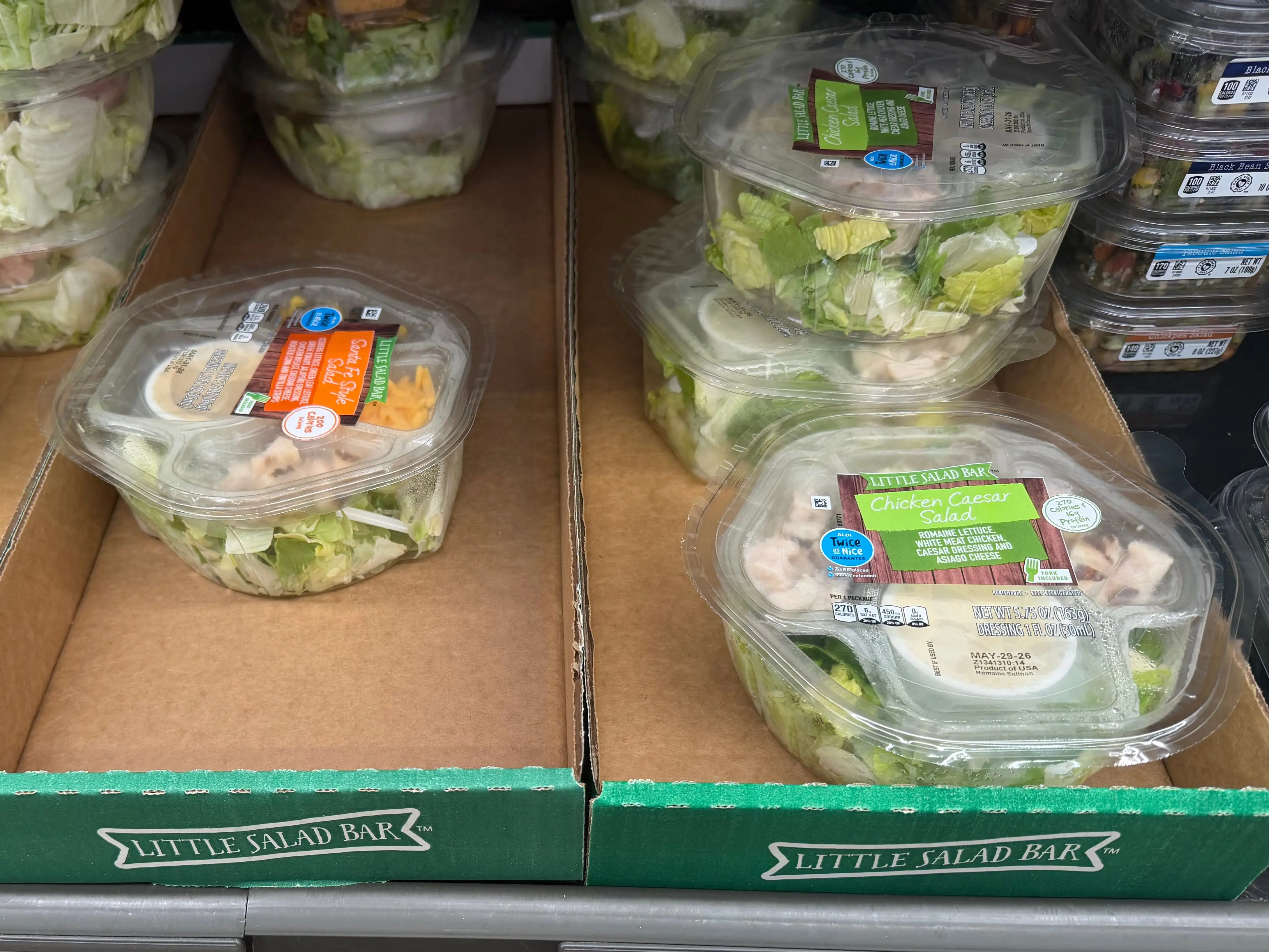 Containers of Little Salad Bar Caesar salads at Aldi.
