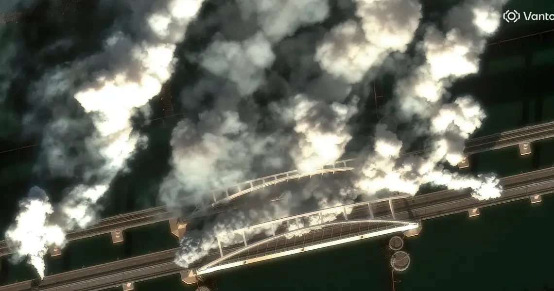 Satellite images show Russian forces throwing up smoke screens on a key Crimean bridge as Ukrainian drones target supply lines