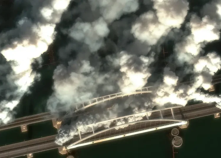 Satellite images show Russian forces throwing up smoke screens on a key Crimean bridge as Ukrainian drones target supply lines