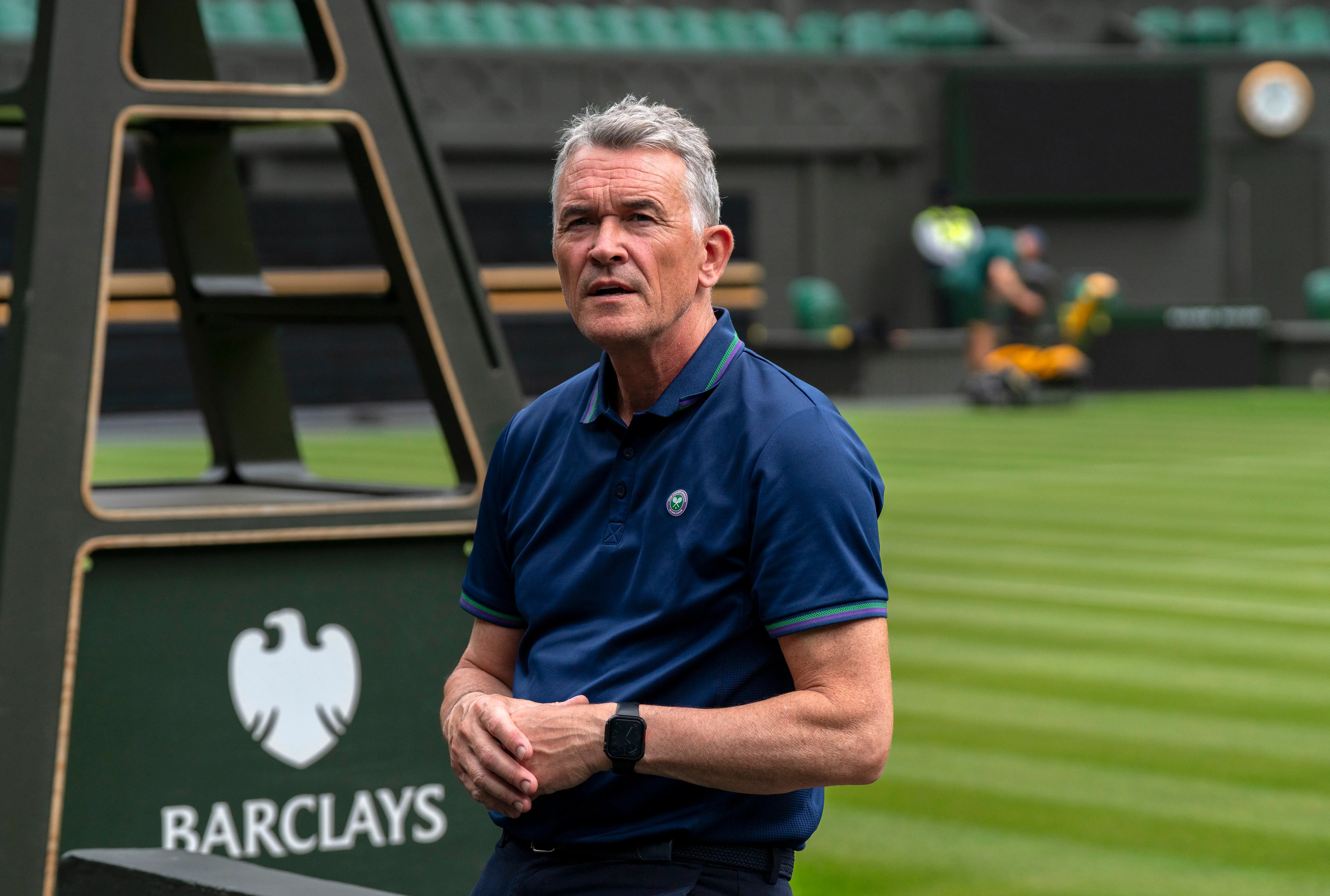 Neil Stubley, the Head of Courts and Horticulture at Wimbledon stands by the turf in Centre Court.
